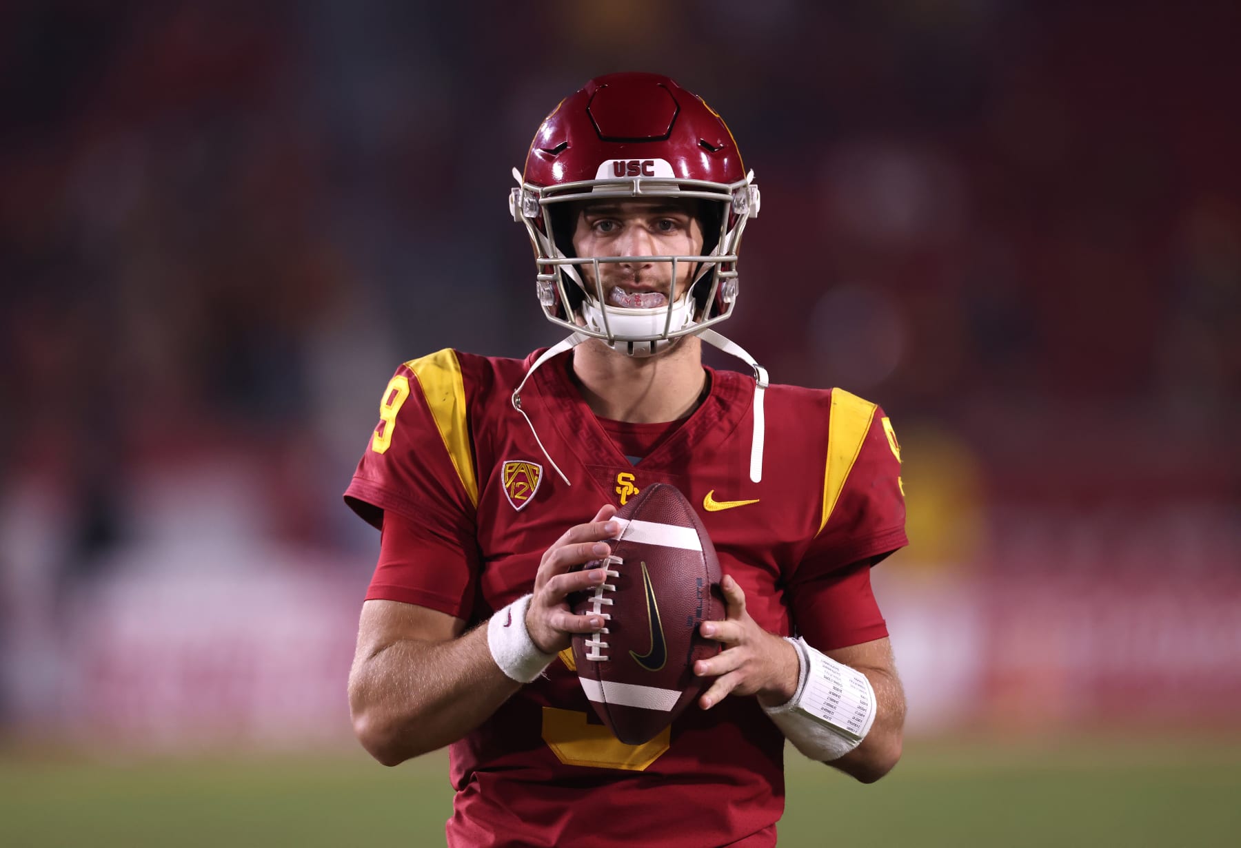 LOS ANGELES, CALIFORNIA - OCTOBER 30: Kedon Slovis #9 of the USC Trojans warms up on the sidelines during the second half against the Arizona Wildcats at Los Angeles Memorial Coliseum on October 30, 2021 in Los Angeles, California. (Photo by Harry How/Getty Images)