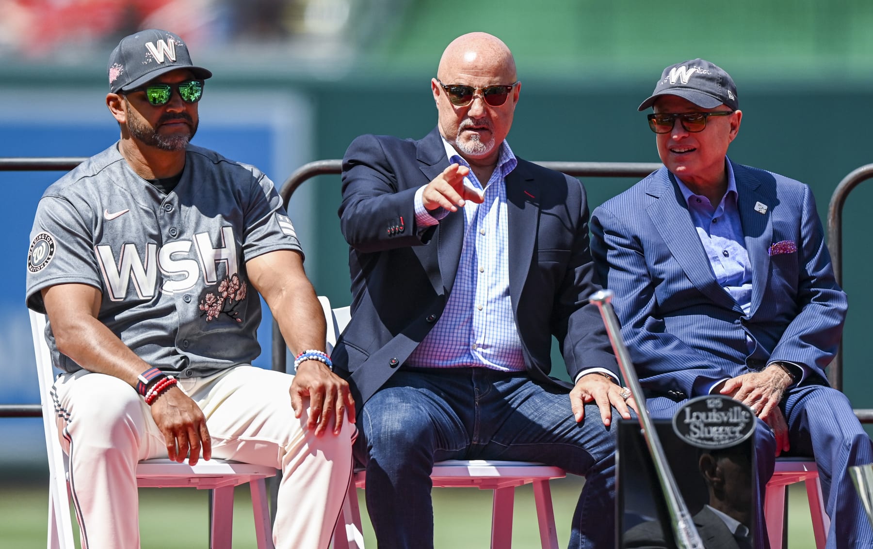 WASHINGTON, DC - JUNE 18: Washington Nationals manager Dave Martinez (4) along with GM Mike Rizzo and principal owner Mark Lerner  during a pregame ceremony Saturday at Nationals Park, Ryan Zimmerman became the first Nationals player to have his jersey number retired. Washingtons first draft pick, who announced his retirement in February, established himself as the face of the franchise over the past 17 years while setting numerous team records and helping the Nationals win their first World Series title. Photo by Jonathan Newton/The Washington Post via Getty Images)