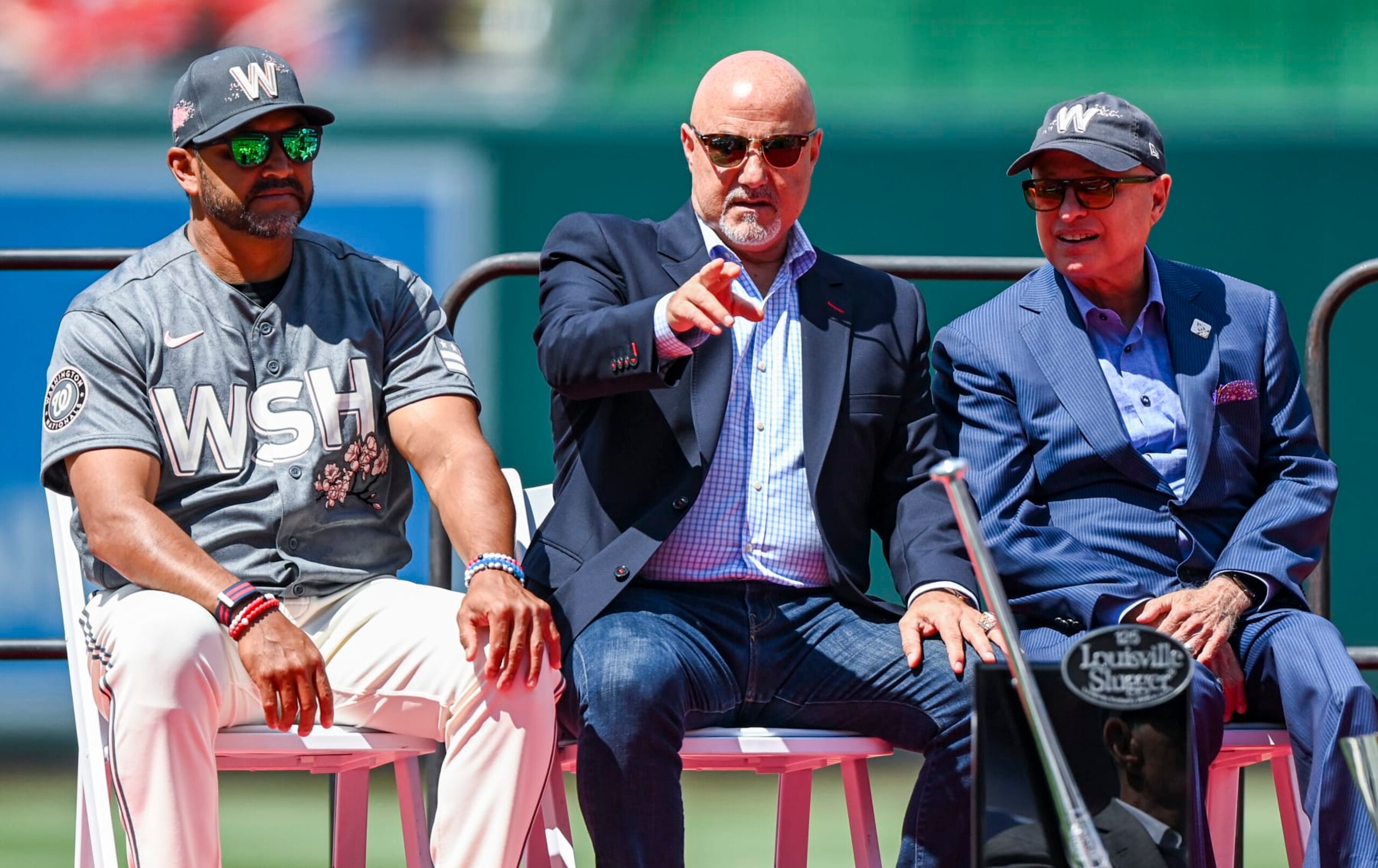 WASHINGTON, DC - JUNE 18: Washington Nationals manager Dave Martinez (4) along with GM Mike Rizzo and principal owner Mark Lerner during a pregame ceremony Saturday at Nationals Park, Ryan Zimmerman became the first Nationals player to have his jersey number retired. Washingtons first draft pick, who announced his retirement in February, established himself as the face of the franchise over the past 17 years while setting numerous team records and helping the Nationals win their first World Series title. Photo by Jonathan Newton/The Washington Post via Getty Images) WASHINGTON, DC - JUNE 18: Washington Nationals manager Dave Martinez (4) along with GM Mike Rizzo and principal owner Mark Lerner during a pregame ceremony Saturday at Nationals Park, Ryan Zimmerman became the first Nationals player to have his jersey number retired. Washingtons first draft pick, who announced his retirement in February, established himself as the face of the franchise over the past 17 years while setting numerous team records and helping the Nationals win their first World Series title. Photo by Jonathan Newton/The Washington Post via Getty Images)