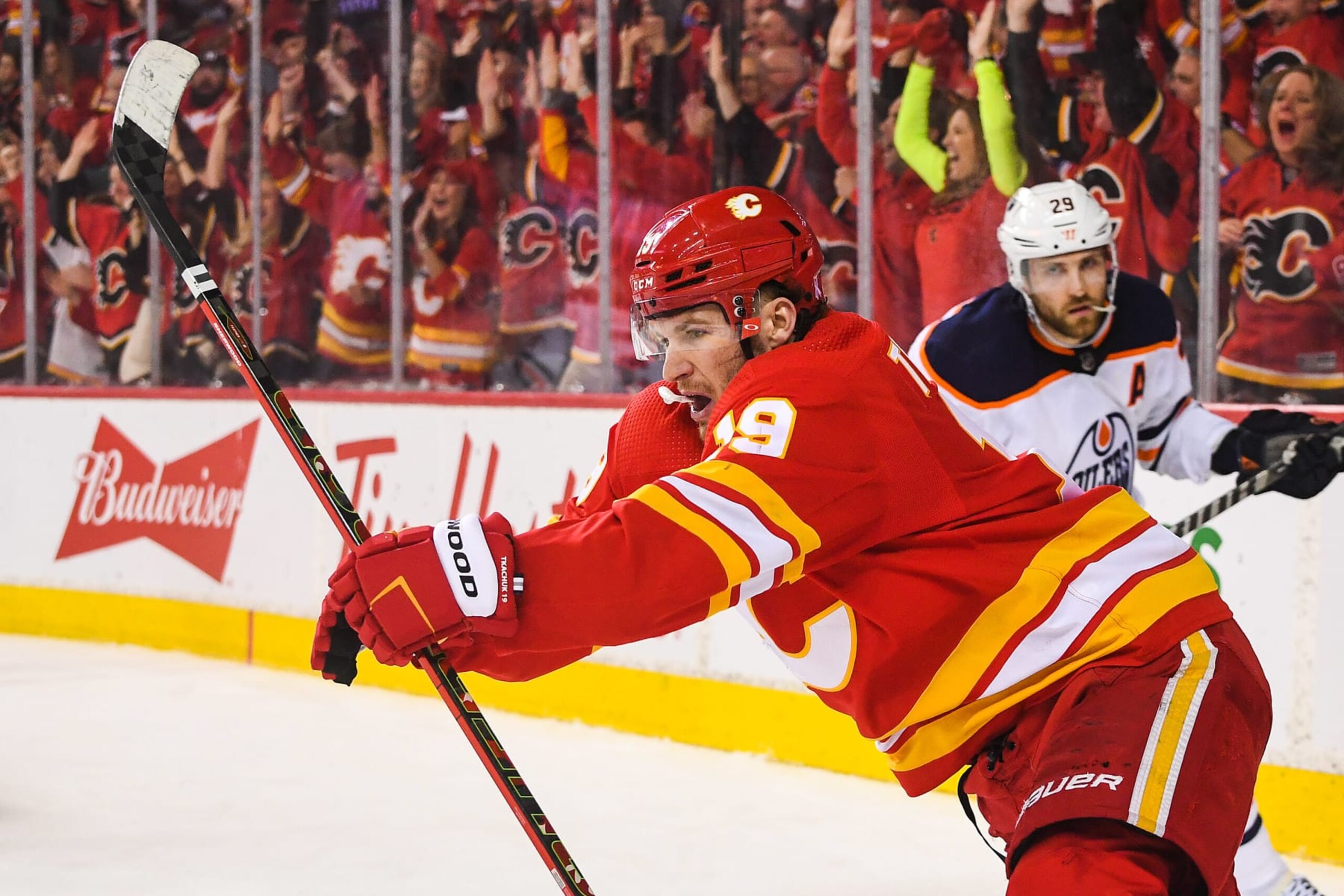 CALGARY, AB - MAY 18: Matthew Tkachuk #19 of the Calgary Flames celebrates after scoring against the Edmonton Oilers during the third period of Game One of the Second Round of the 2022 Stanley Cup Playoffs at Scotiabank Saddledome on May 18, 2022 in Calgary, Alberta, Canada. (Photo by Derek Leung/Getty Images)