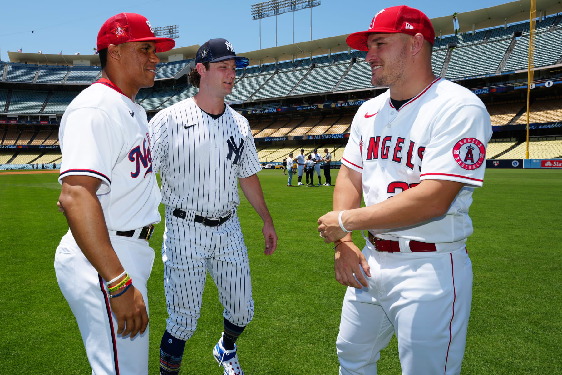 LOS ANGELES, CA - JULY 18:  Juan Soto #22 of the Washington Nationals, Gerrit Cole #45 of the New York Yankees and Mike Trout #27 of the Los Angeles Angels talk on the field during the Gatorade All-Star Workout Day at Dodger Stadium on Monday, July 18, 2022 in Los Angeles, California. (Photo by Daniel Shirey/MLB Photos via Getty Images)