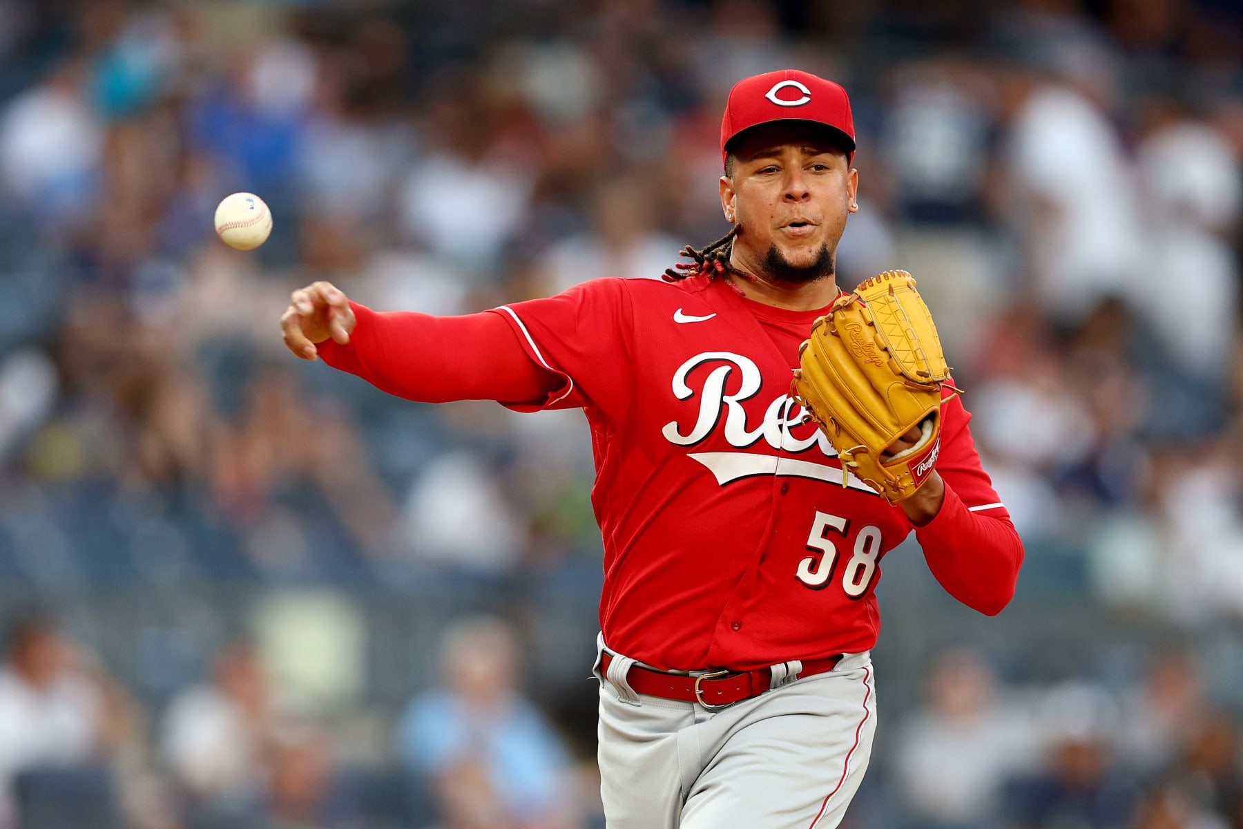 NEW YORK, NEW YORK - JULY 14:  Luis Castillo #58 of the Cincinnati Reds tries to pick off Aaron Judge #99 of the New York Yankees at first base in the first inning at Yankee Stadium on July 14, 2022 in the Bronx borough of New York City. (Photo by Elsa/Getty Images)