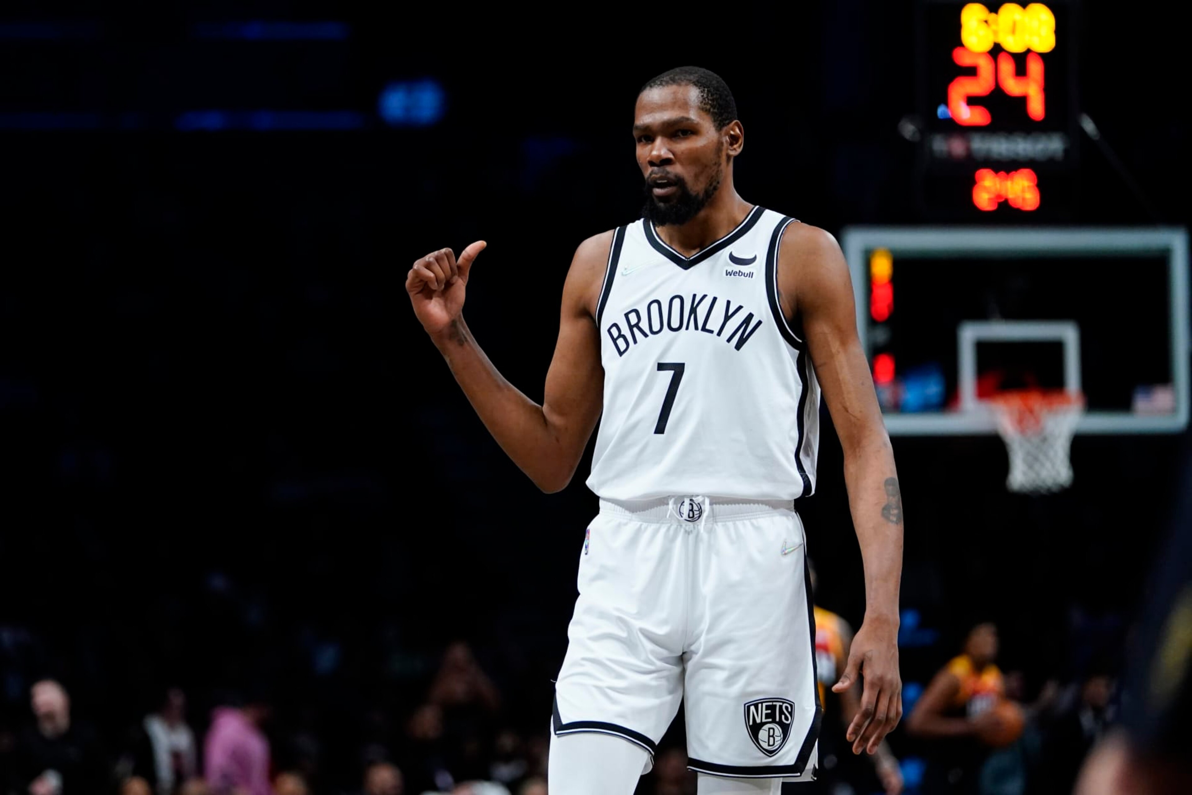 Brooklyn Nets' Kevin Durant (7) gestures as he talks to fans during the second half of an NBA basketball game against the Utah Jazz, Monday, March 21, 2022, in New York. (AP Photo/Frank Franklin II)