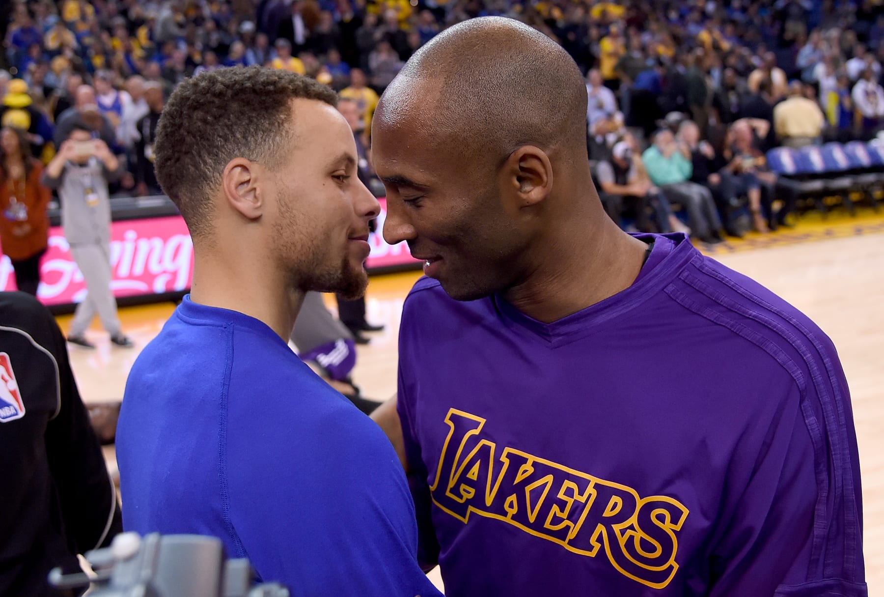 OAKLAND, CA - NOVEMBER 24:  Stephen Curry #30 of the Golden State Warriors meets at center court with Kobe Bryant #24 of the Los Angeles Laker prior to the start of their NBA basketball game at ORACLE Arena on November 24, 2015 in Oakland, California. NOTE TO USER: User expressly acknowledges and agrees that, by downloading and or using this photograph, User is consenting to the terms and conditions of the Getty Images License Agreement.  (Photo by Thearon W. Henderson/Getty Images)