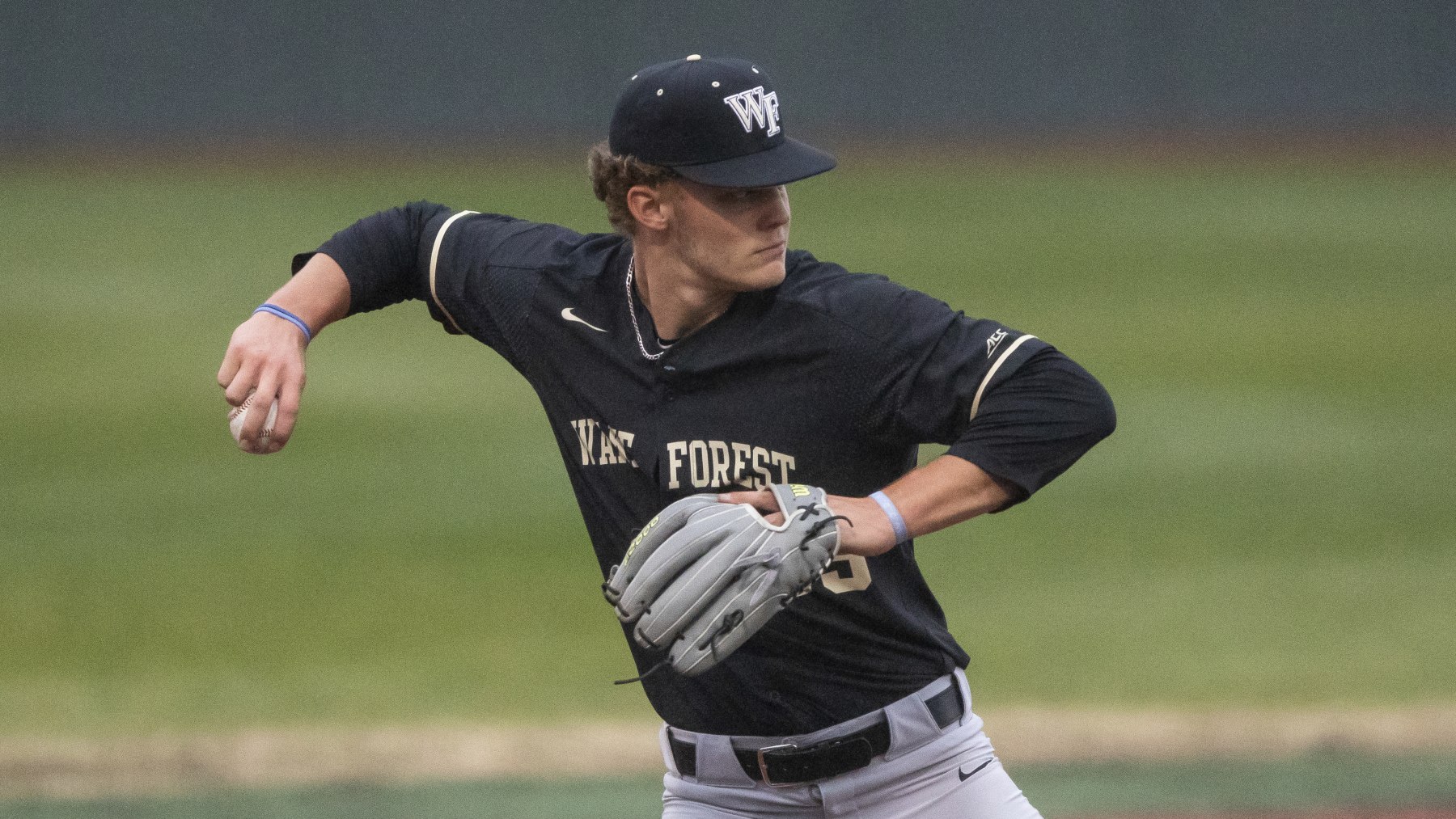 Wake Forest's Brock Wilken (25) makes a throw during an NCAA baseball game on Tuesday, March 23, 2021, in Elon, N.C. (AP Photo/Ben McKeown)