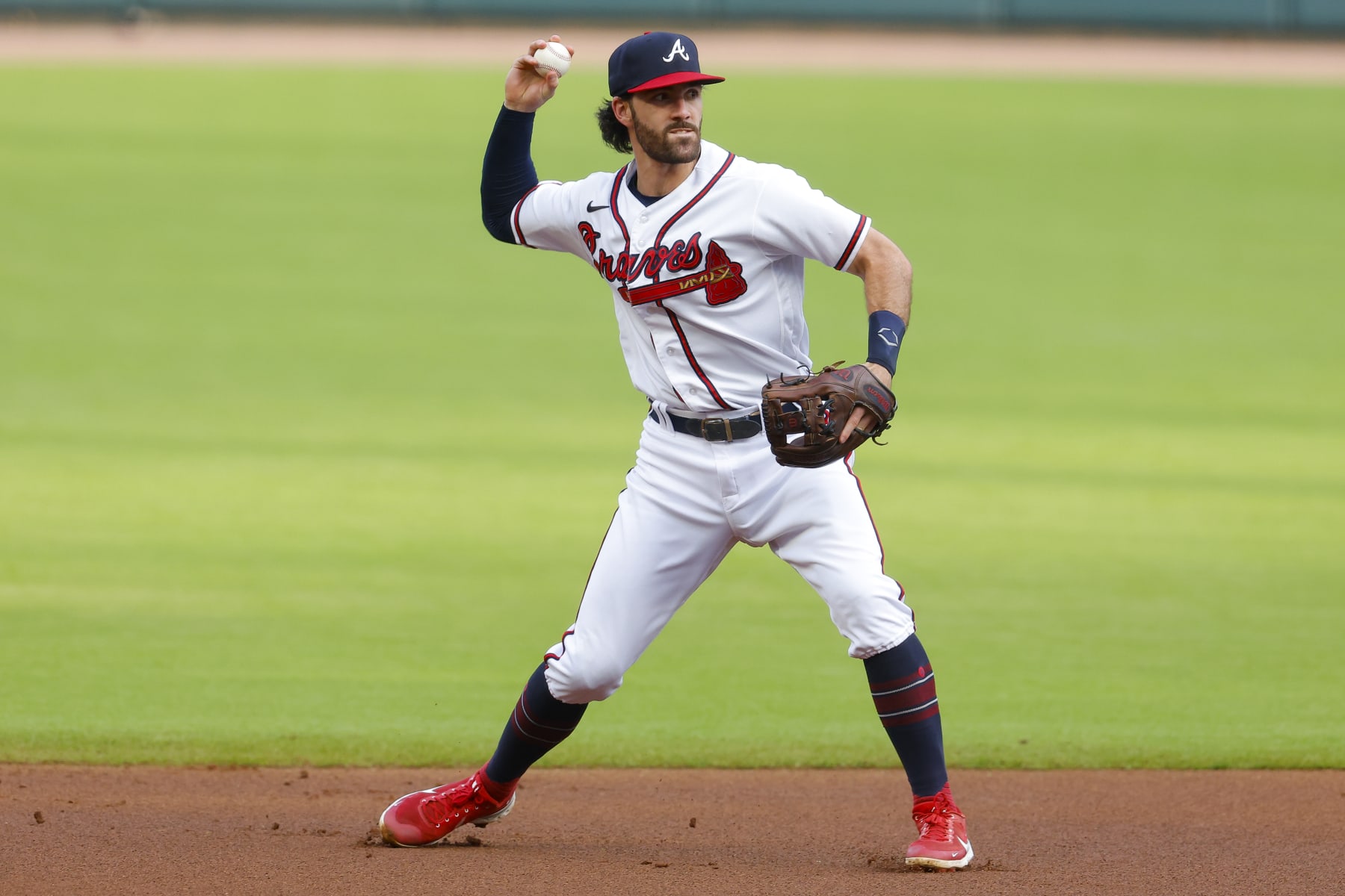 ATLANTA, GA - JULY 12: Dansby Swanson #7 of the Atlanta Braves throws to first during the first inning against the New York Mets at Truist Park on July 12, 2022 in Atlanta, Georgia. (Photo by Todd Kirkland/Getty Images)