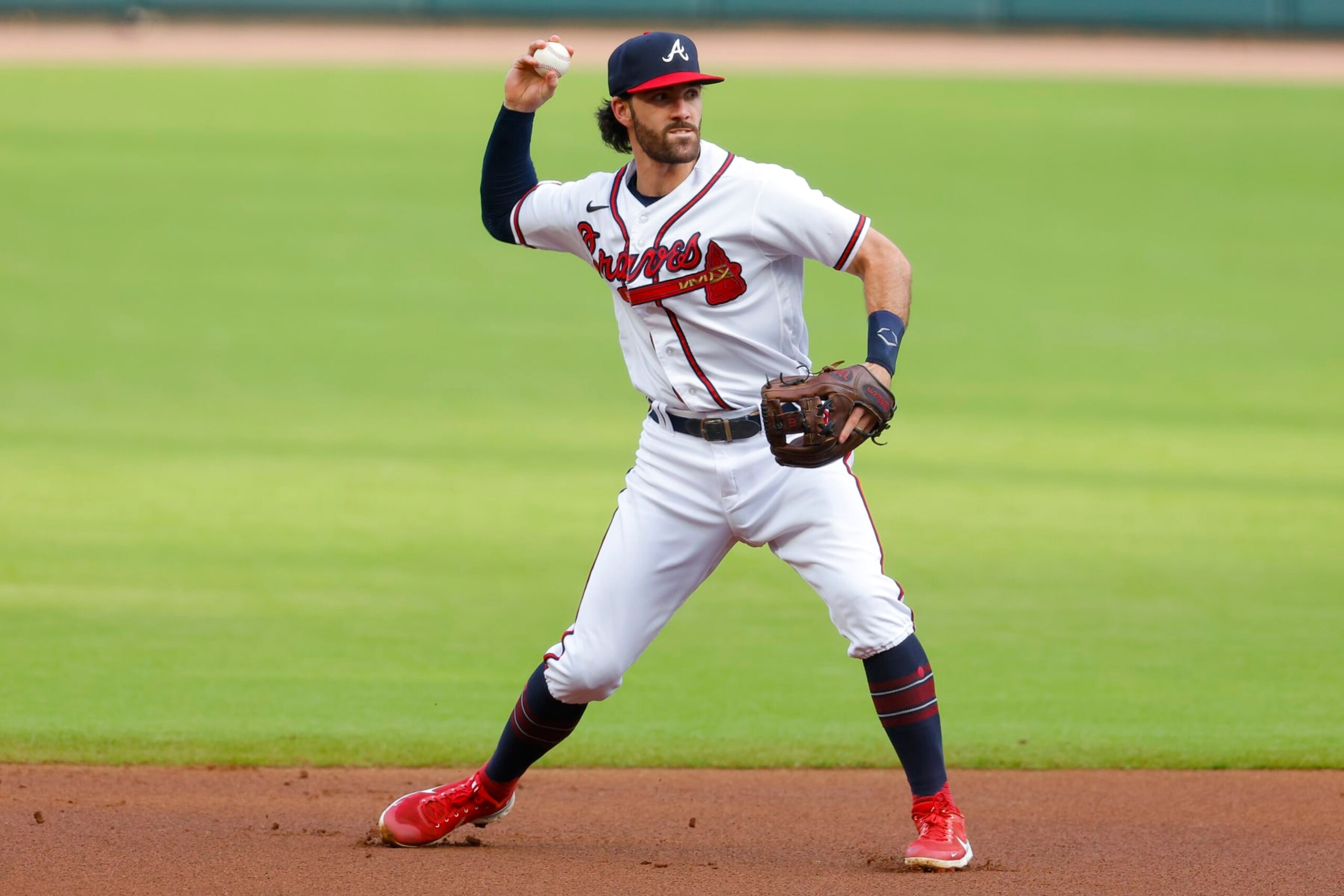 ATLANTA, GA - JULY 12: Dansby Swanson #7 of the Atlanta Braves throws to first during the first inning against the New York Mets at Truist Park on July 12, 2022 in Atlanta, Georgia. (Photo by Todd Kirkland/Getty Images)