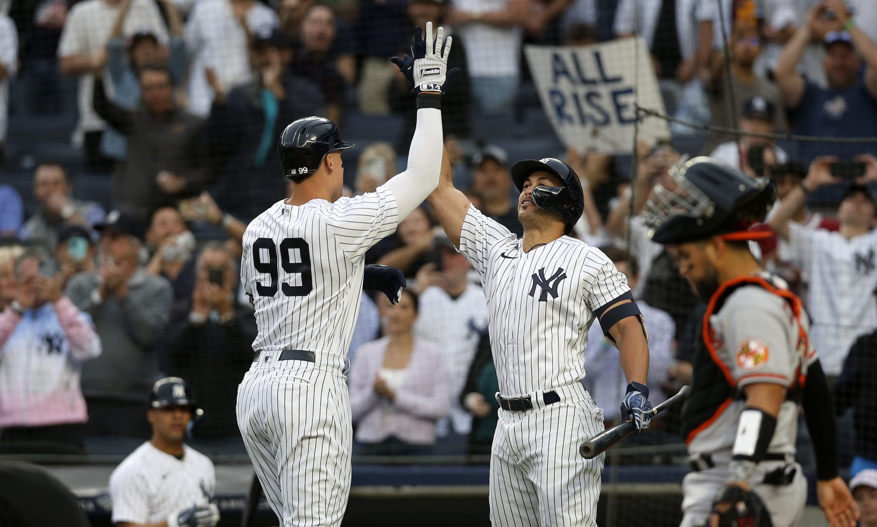 NEW YORK, NEW YORK - MAY 23:  Aaron Judge #99 of the New York Yankees celebrates his home run during the first inning against the Baltimore Orioles with teammate Giancarlo Stanton #27 at Yankee Stadium on May 23, 2022 in New York City. (Photo by Jim McIsaac/Getty Images)