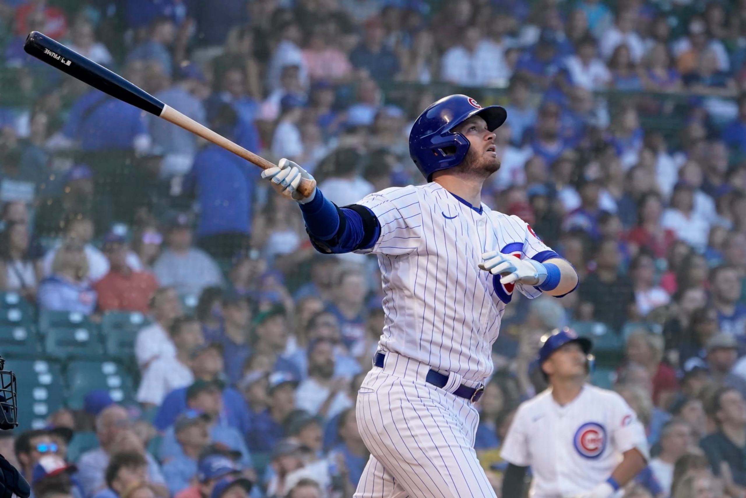 Chicago Cubs' Ian Happ watches his home run off Baltimore Orioles starting pitcher Jordan Lyles during the first inning of a baseball game Tuesday, July 12, 2022, in Chicago. (AP Photo/Charles Rex Arbogast)