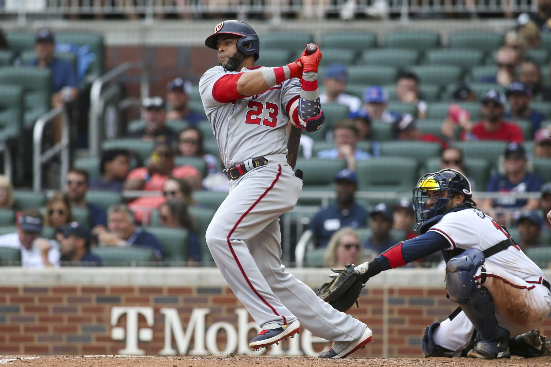 ATLANTA, GA - JULY 09: Nelson Cruz #23 of the Washington Nationals hits a RBI single against the Atlanta Braves in the eighth inning at Truist Park on July 9, 2022 in Atlanta, Georgia. (Photo by Brett Davis/Getty Images)
