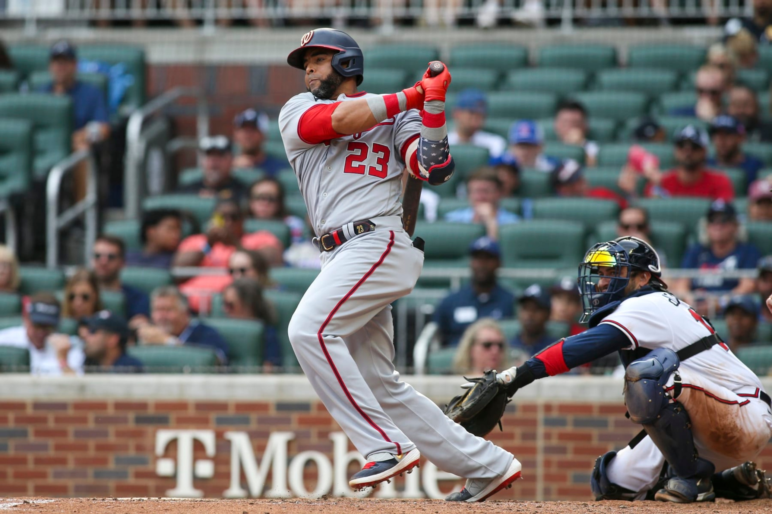 ATLANTA, GA - JULY 09: Nelson Cruz #23 of the Washington Nationals hits a RBI single against the Atlanta Braves in the eighth inning at Truist Park on July 9, 2022 in Atlanta, Georgia. (Photo by Brett Davis/Getty Images)