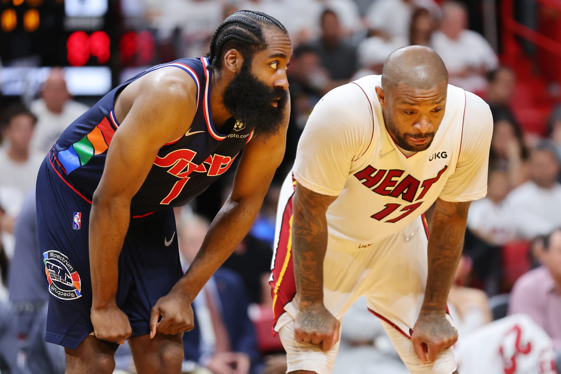 MIAMI, FLORIDA - MAY 04: James Harden #1 of the Philadelphia 76ers and P.J. Tucker #17 of the Miami Heat look on during the second half in Game Two of the Eastern Conference Semifinals at FTX Arena on May 04, 2022 in Miami, Florida. NOTE TO USER: User expressly acknowledges and agrees that, by downloading and or using this photograph, User is consenting to the terms and conditions of the Getty Images License Agreement. (Photo by Michael Reaves/Getty Images)