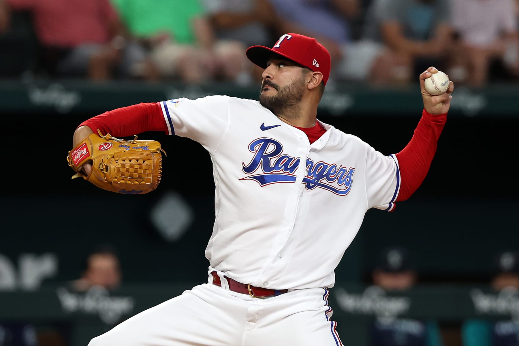 ARLINGTON, TEXAS - JULY 14: Martin Perez #54 of the Texas Rangers pitches in the first inning against the Seattle Mariners at Globe Life Field on July 14, 2022 in Arlington, Texas. (Photo by Richard Rodriguez/Getty Images)