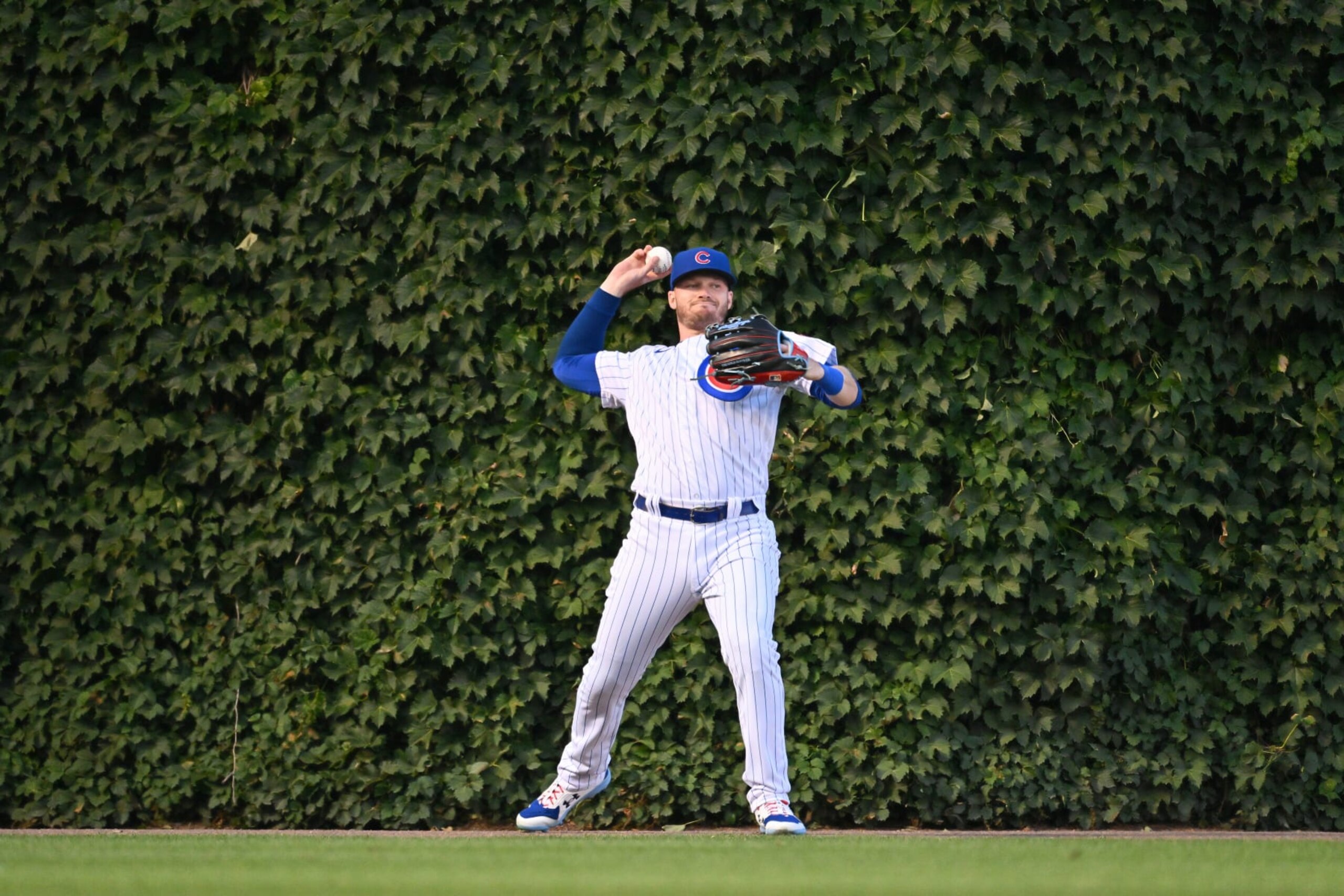 CHICAGO, IL - JULY 12:  Ian Happ #8 of the Chicago Cubs throws from the outfield against the Baltimore Orioles at Wrigley Field on July 12, 2022 in Chicago, Illinois.  (Photo by Jamie Sabau/Getty Images)