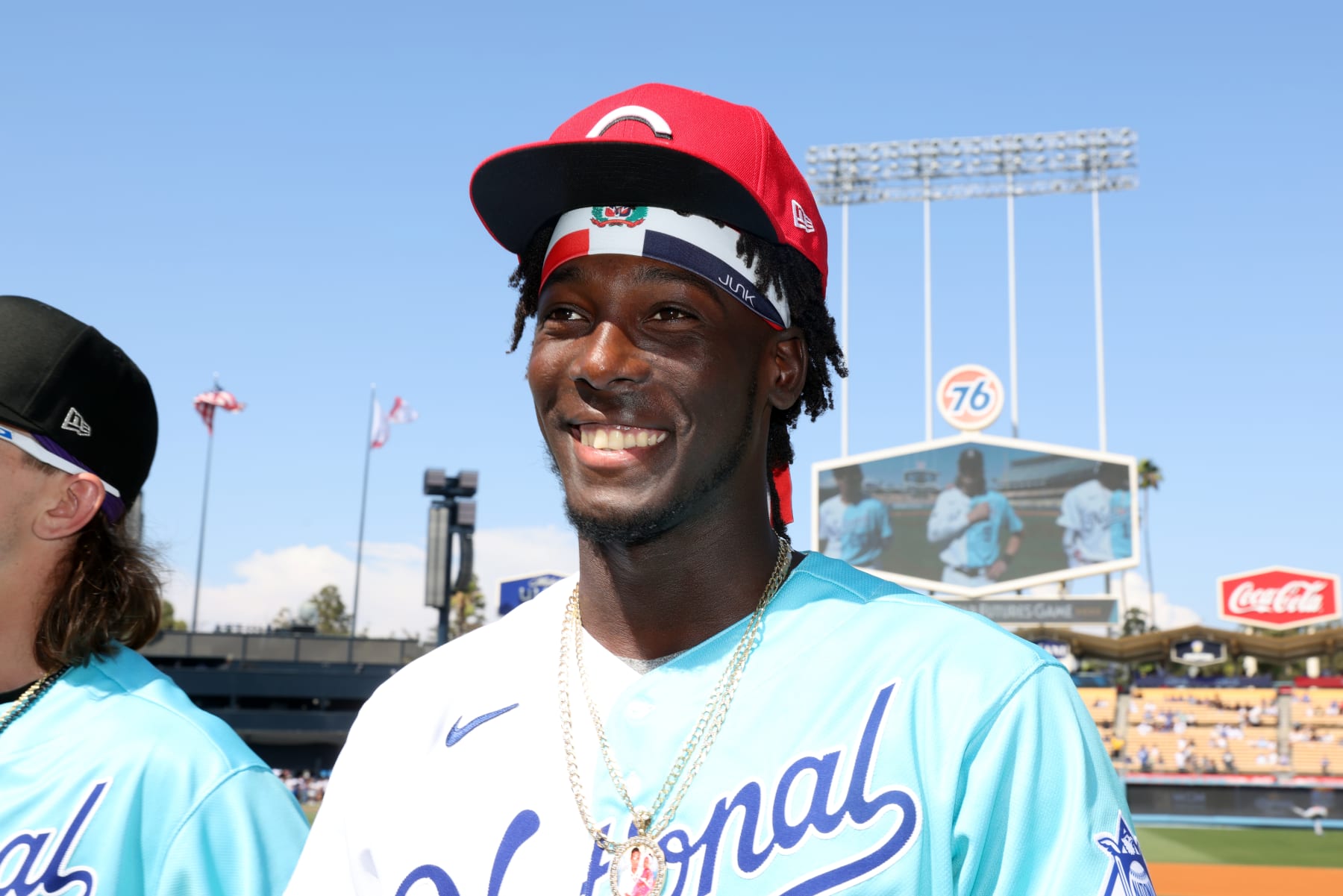 LOS ANGELES, CA - JULY 16:  Elly De La Cruz #18 of the Cincinnati Reds acknowledges the crowd during player introductions prior to the 2022 SiriusXM All-Star Futures Game at Dodger Stadium on Saturday, July 16, 2022 in Los Angeles, California. (Photo by Rob Tringali/MLB Photos via Getty Images)