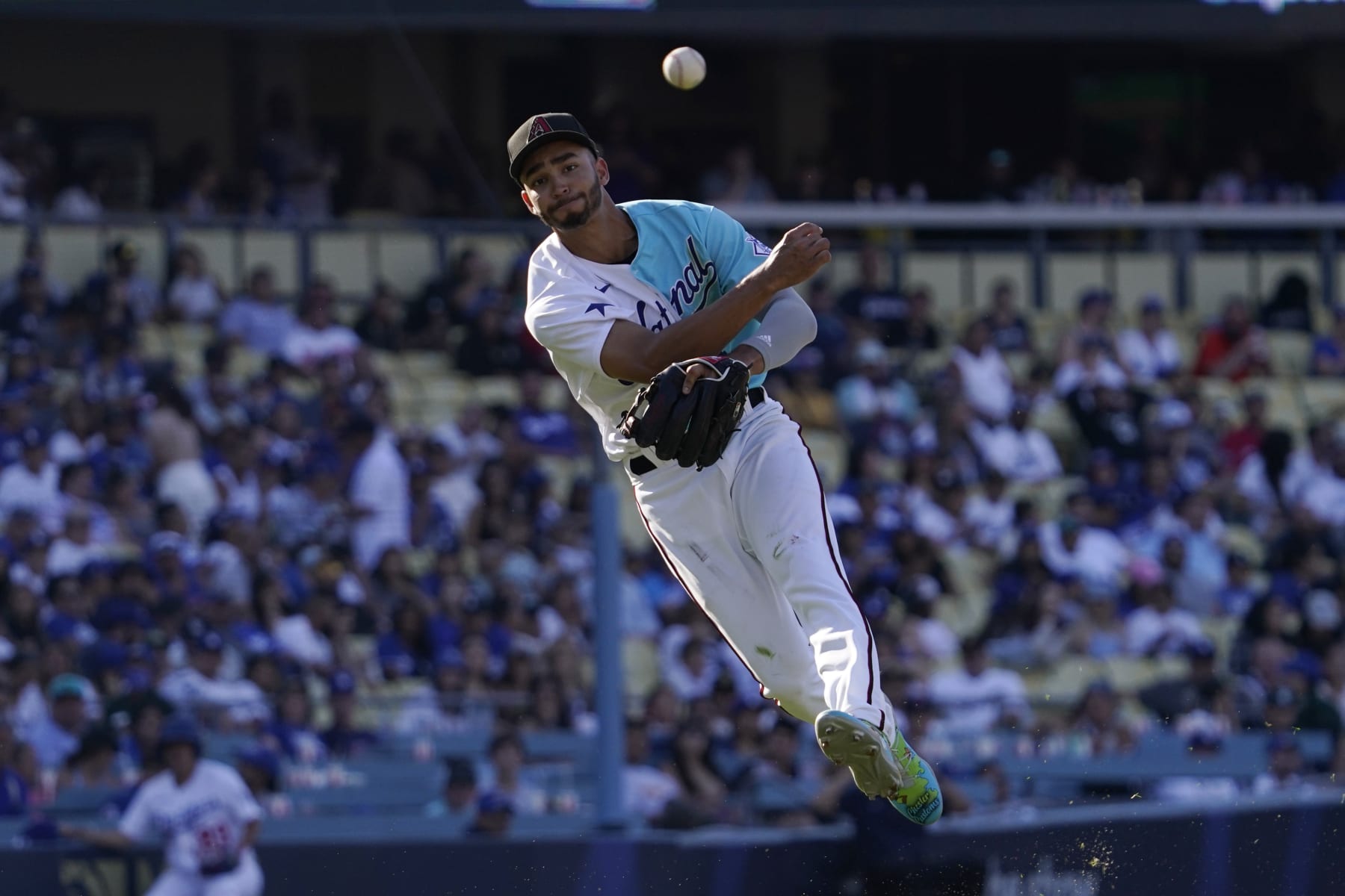 National League's Jordan Lawlar makes an off balance throw to put out American League's Jhonkensy Noel during the fifth inning of the MLB All-Star Futures baseball game, Saturday, July 16, 2022, in Los Angeles. (AP Photo/Mark J. Terrill)