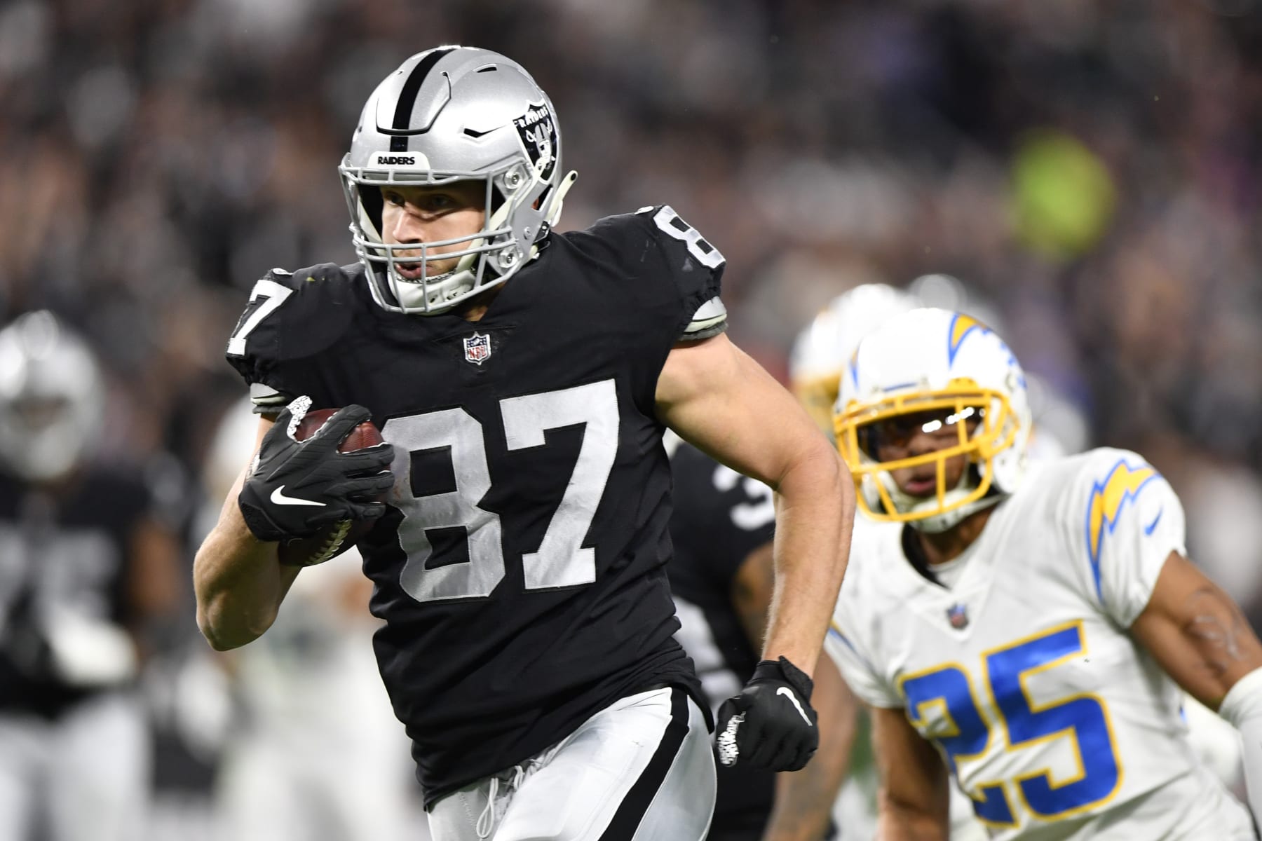 LAS VEGAS, NEVADA - JANUARY 09:  Tight end Foster Moreau #87 of the Las Vegas Raiders runs against the Los Angeles Chargers during the first half of a game at Allegiant Stadium on January 09, 2022 in Las Vegas, Nevada. The Raiders defeated the Chargers 35-32 in overtime. (Photo by Chris Unger/Getty Images)