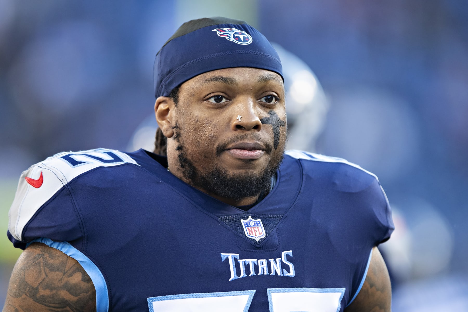 NASHVILLE, TENNESSEE - JANUARY 22: Derrick Henry #22 of the Tennessee Titans warms up before a game against the Cincinnati Bengals in the AFC Divisional Playoff game at Nissan Stadium on January 22, 2022 in Nashville, Tennessee. The Bengals defeated the Titans 19-16.  (Photo by Wesley Hitt/Getty Images)