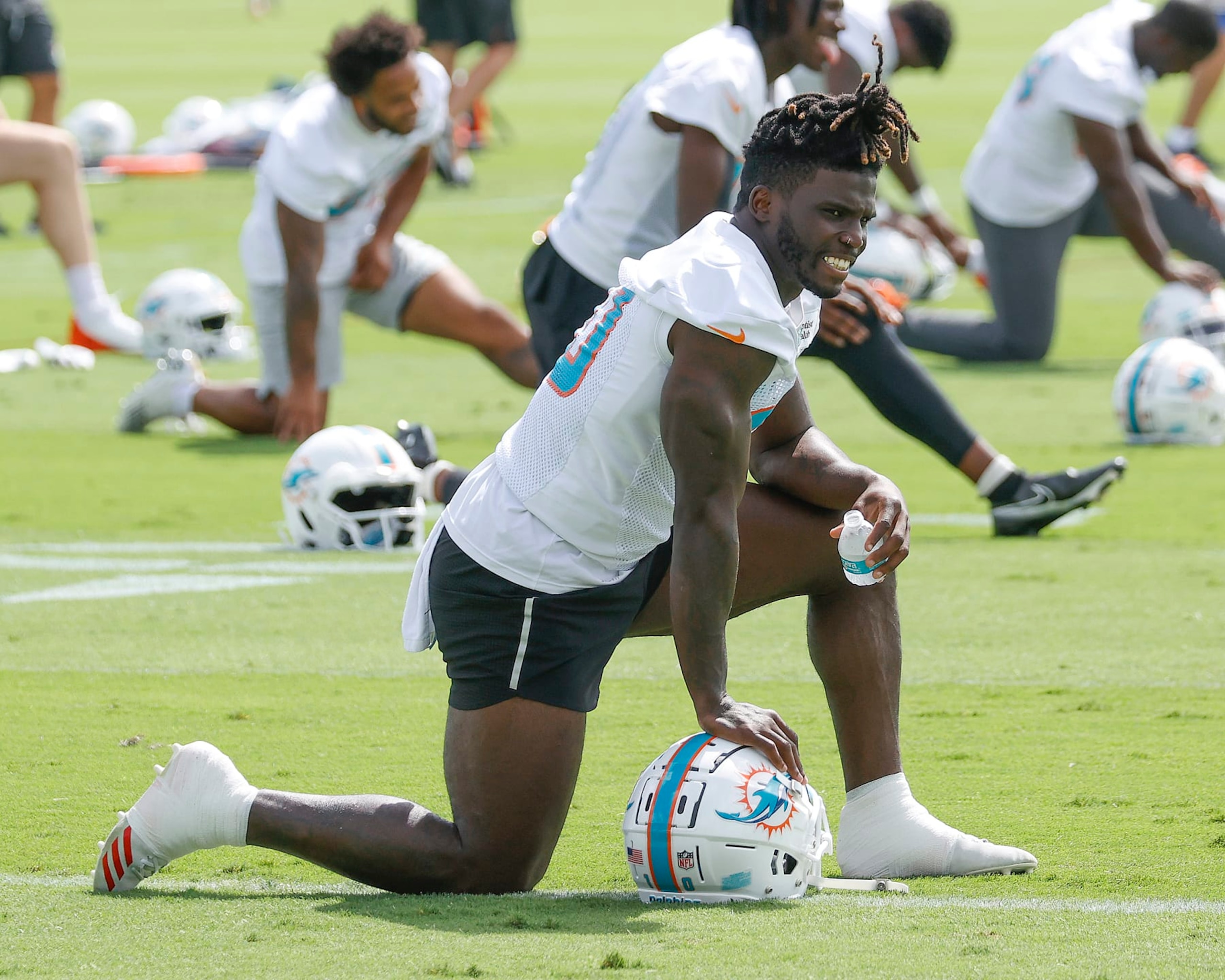 MIAMI GARDENS, FL - JUNE 2: Tyreek Hill #10 of the Miami Dolphins stretches during the Miami Dolphins Mandatory Minicamp at the Baptist Health Training Complex on June 2, 2022 in Miami Gardens, Florida. (Photo by Joel Auerbach/Getty Images)
