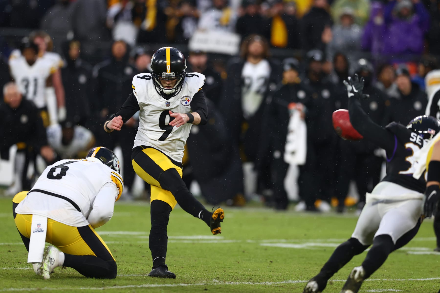 BALTIMORE, MARYLAND - JANUARY 09: Chris Boswell #9 of the Pittsburgh Steelers kicks the game winning field goal in overtime in the game against the Baltimore Ravens at M&T Bank Stadium on January 09, 2022 in Baltimore, Maryland. (Photo by Todd Olszewski/Getty Images)