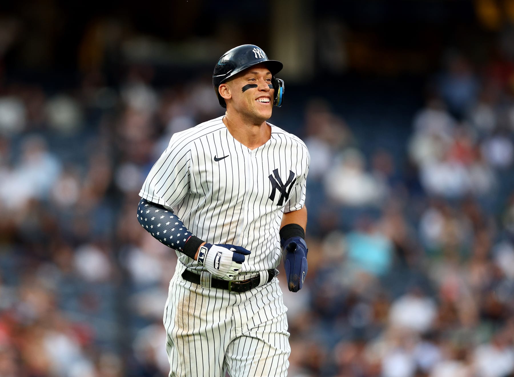 NEW YORK, NEW YORK - JULY 14: Aaron Judge #99 of the New York Yankees smiles as he heads to first against the Cincinnati Reds at Yankee Stadium on July 14, 2022 in the Bronx borough of New York City. (Photo by Elsa/Getty Images) NEW YORK, NEW YORK - JULY 14: Aaron Judge #99 of the New York Yankees smiles as he heads to first against the Cincinnati Reds at Yankee Stadium on July 14, 2022 in the Bronx borough of New York City. (Photo by Elsa/Getty Images)