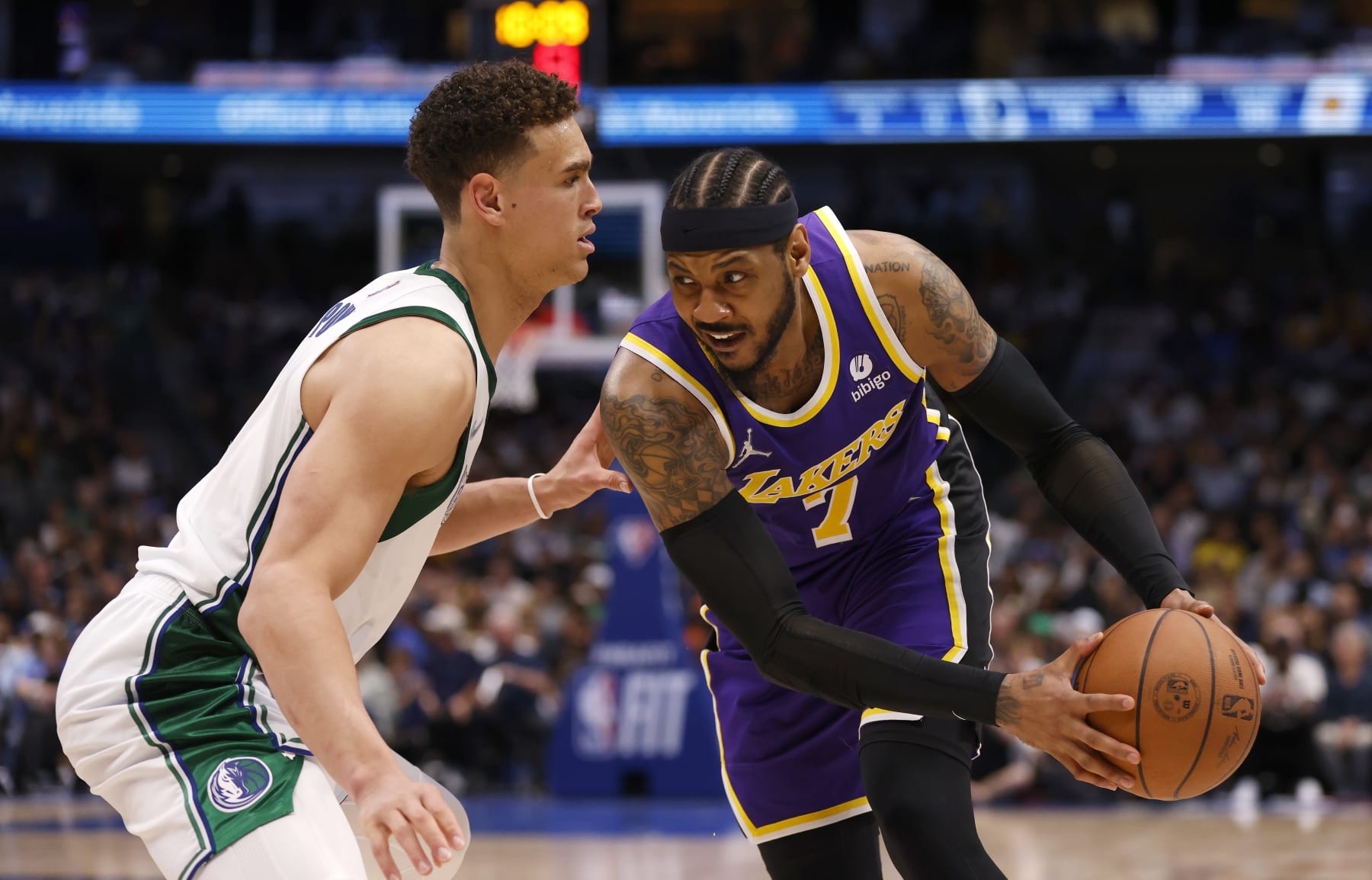 DALLAS, TX - MARCH 29: Carmelo Anthony #7 of the Los Angeles Lakers handles the ball as Dwight Powell #7 of the Dallas Mavericks defends in the second half at American Airlines Center on March 29, 2022 in Dallas, Texas. The Mavericks won 128-110. NOTE TO USER: User expressly acknowledges and agrees that, by downloading and or using this photograph, User is consenting to the terms and conditions of the Getty Images License Agreement. (Photo by Ron Jenkins/Getty Images)