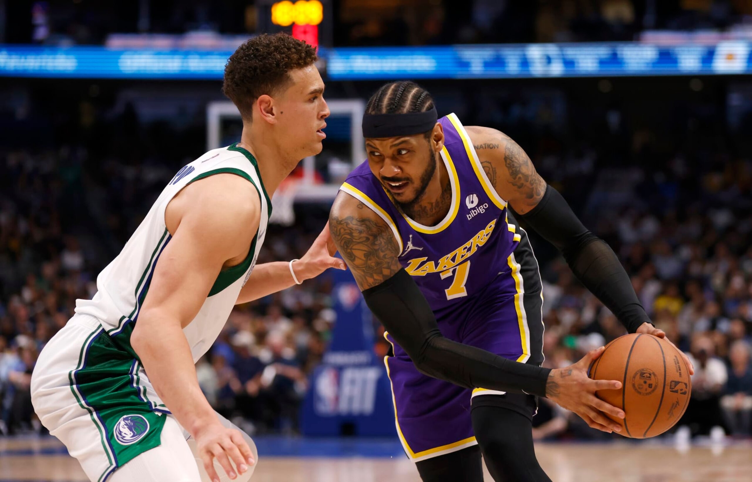 DALLAS, TX - MARCH 29: Carmelo Anthony #7 of the Los Angeles Lakers handles the ball as Dwight Powell #7 of the Dallas Mavericks defends in the second half at American Airlines Center on March 29, 2022 in Dallas, Texas. The Mavericks won 128-110. NOTE TO USER: User expressly acknowledges and agrees that, by downloading and or using this photograph, User is consenting to the terms and conditions of the Getty Images License Agreement. (Photo by Ron Jenkins/Getty Images)