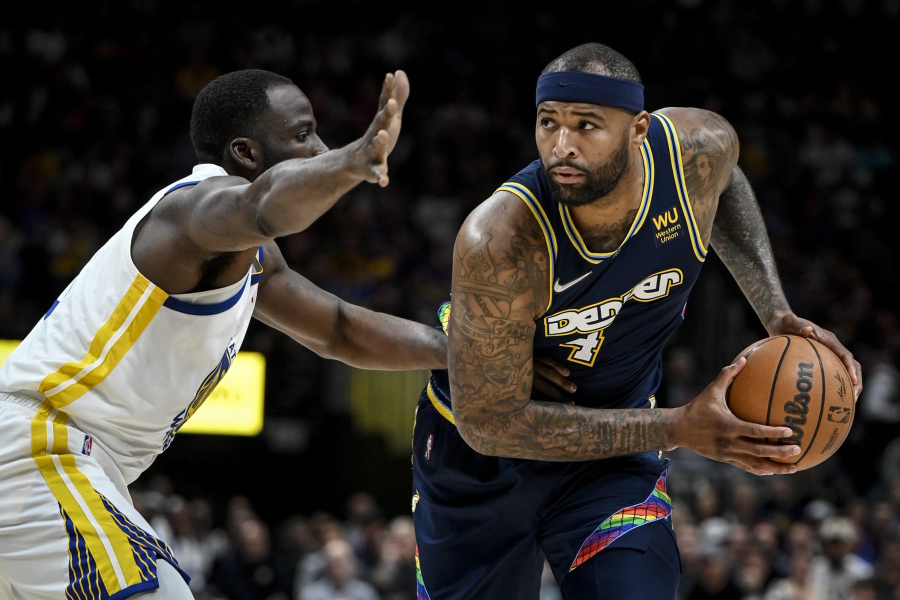 DENVER, CO - APRIL 24: DeMarcus Cousins (4) of the Denver Nuggets is guarded by Draymond Green (23) of the Golden State Warriors during the second quarter at Ball Arena on Sunday, April 24, 2022. (Photo by AAron Ontiveroz/MediaNews Group/The Denver Post via Getty Images)