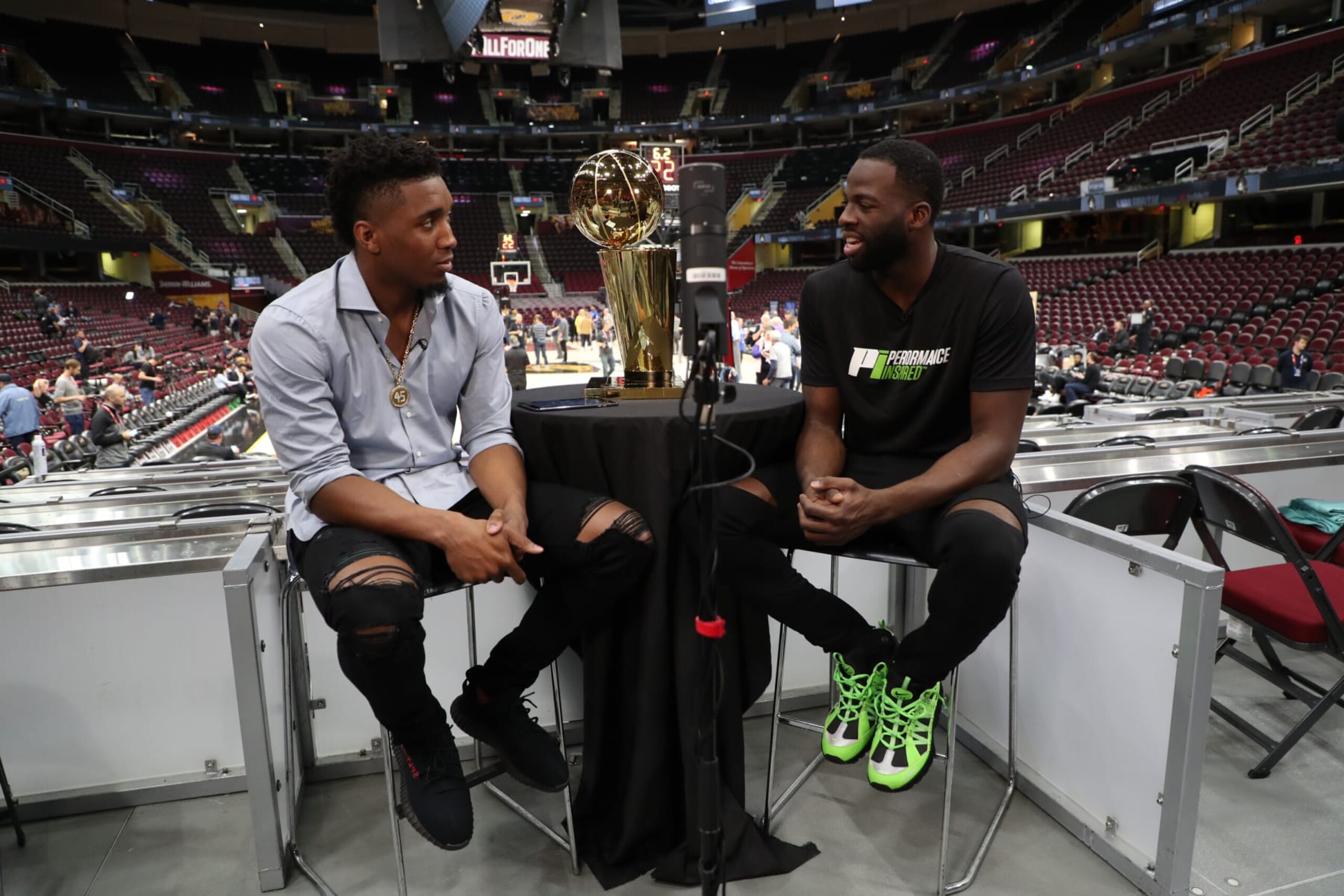 CLEVELAND, OH - JUNE 5: Donovan Mitchell of the Utah Jazz interviews Draymond Green of the Golden State Warriors during practice and media availability as part of the 2018 NBA Finals on June 5, 2018 at Quicken Loans Arena in Cleveland, Ohio. NOTE TO USER: User expressly acknowledges and agrees that, by downloading and or using this photograph, User is consenting to the terms and conditions of the Getty Images License Agreement. Mandatory Copyright Notice: Copyright 2018 NBAE (Photo by David Dow/NBAE via Getty Images)
