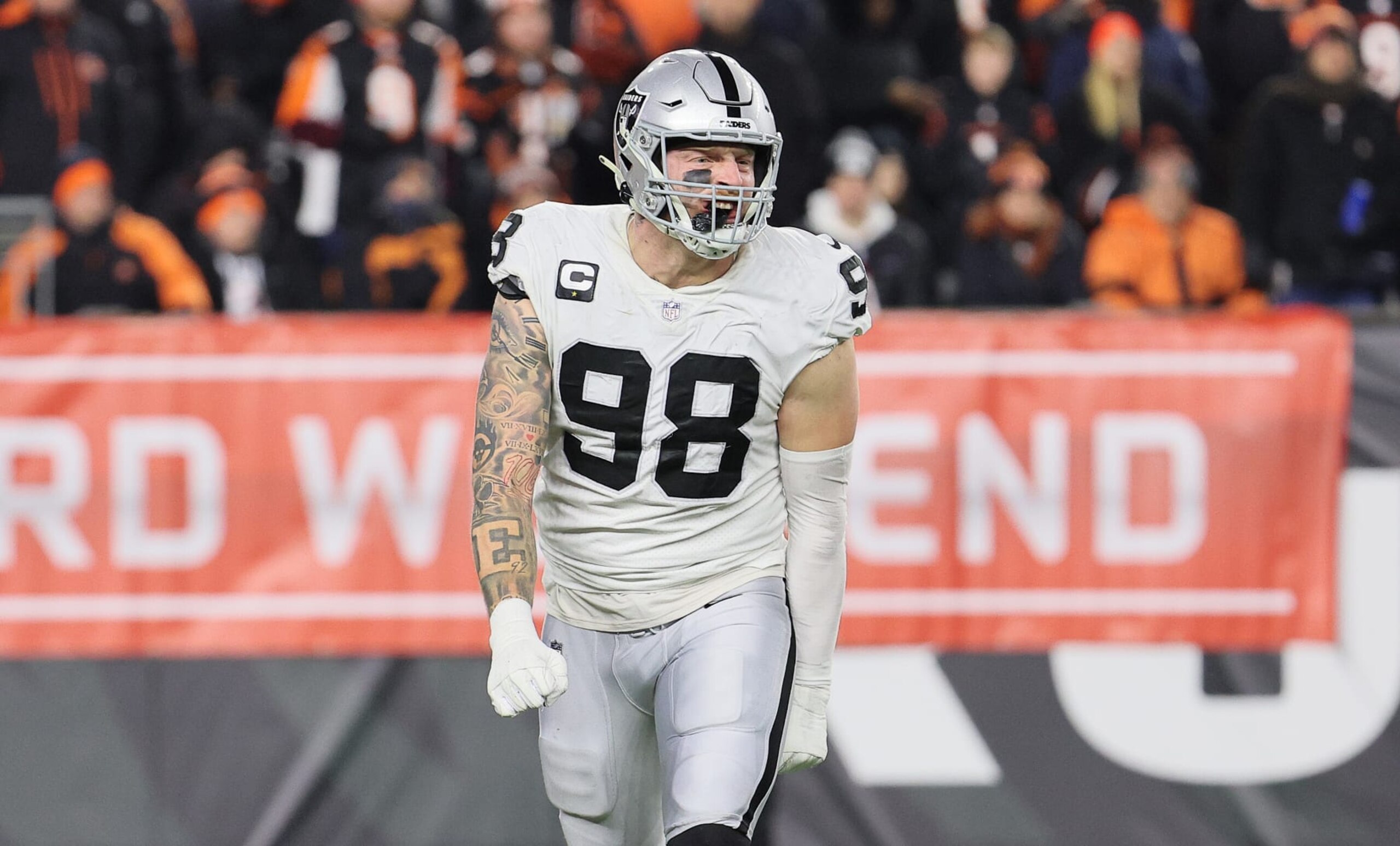 CINCINNATI, OHIO - JANUARY 15: 	Maxx Crosby #98 of the Las Vegas Raiders celebrates against the Cincinnati Bengals during the AFC Wild Card Playoff game at Paul Brown Stadium on January 15, 2022 in Cincinnati, Ohio. (Photo by Andy Lyons/Getty Images)