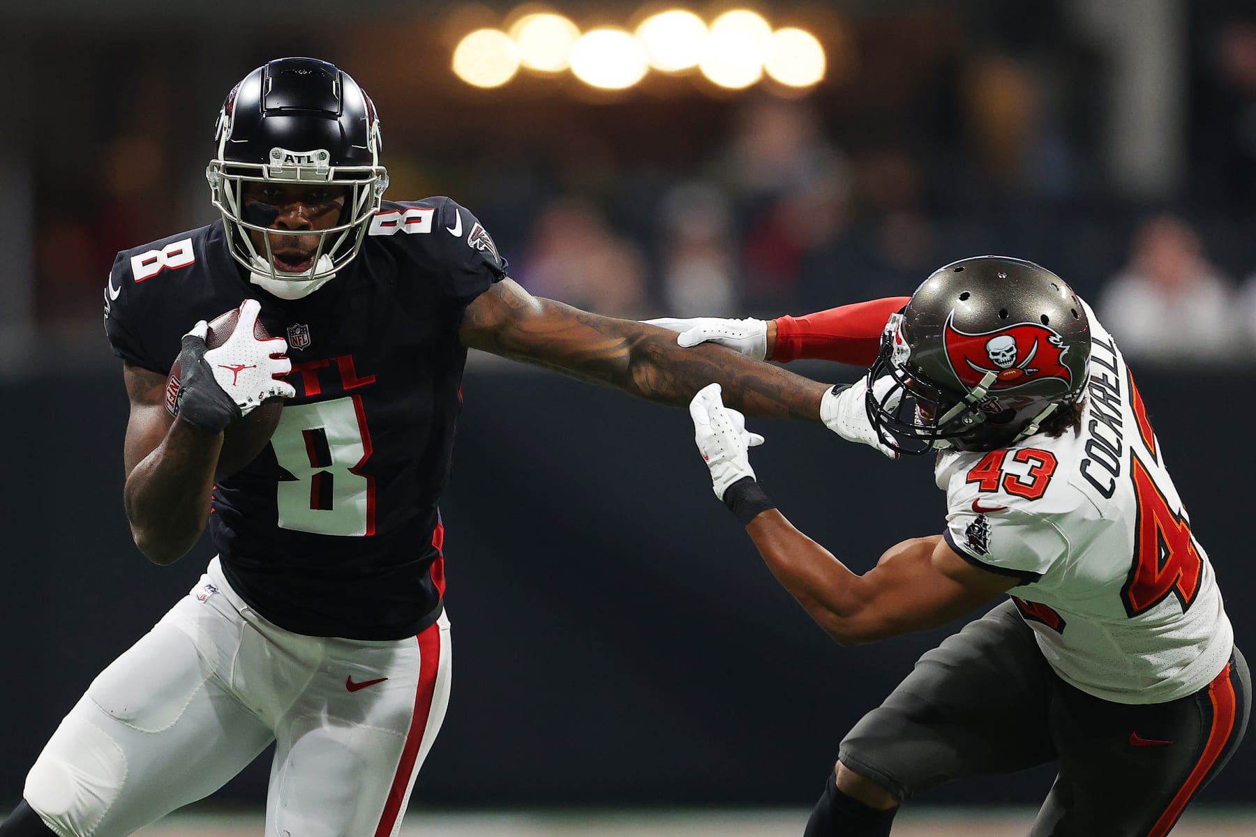 ATLANTA, GEORGIA - DECEMBER 05: Kyle Pitts #8 of the Atlanta Falcons carries the ball after a reception as Ross Cockrell #43 of the Tampa Bay Buccaneers defends during the second quarter at Mercedes-Benz Stadium on December 05, 2021 in Atlanta, Georgia. (Photo by Kevin C. Cox/Getty Images)