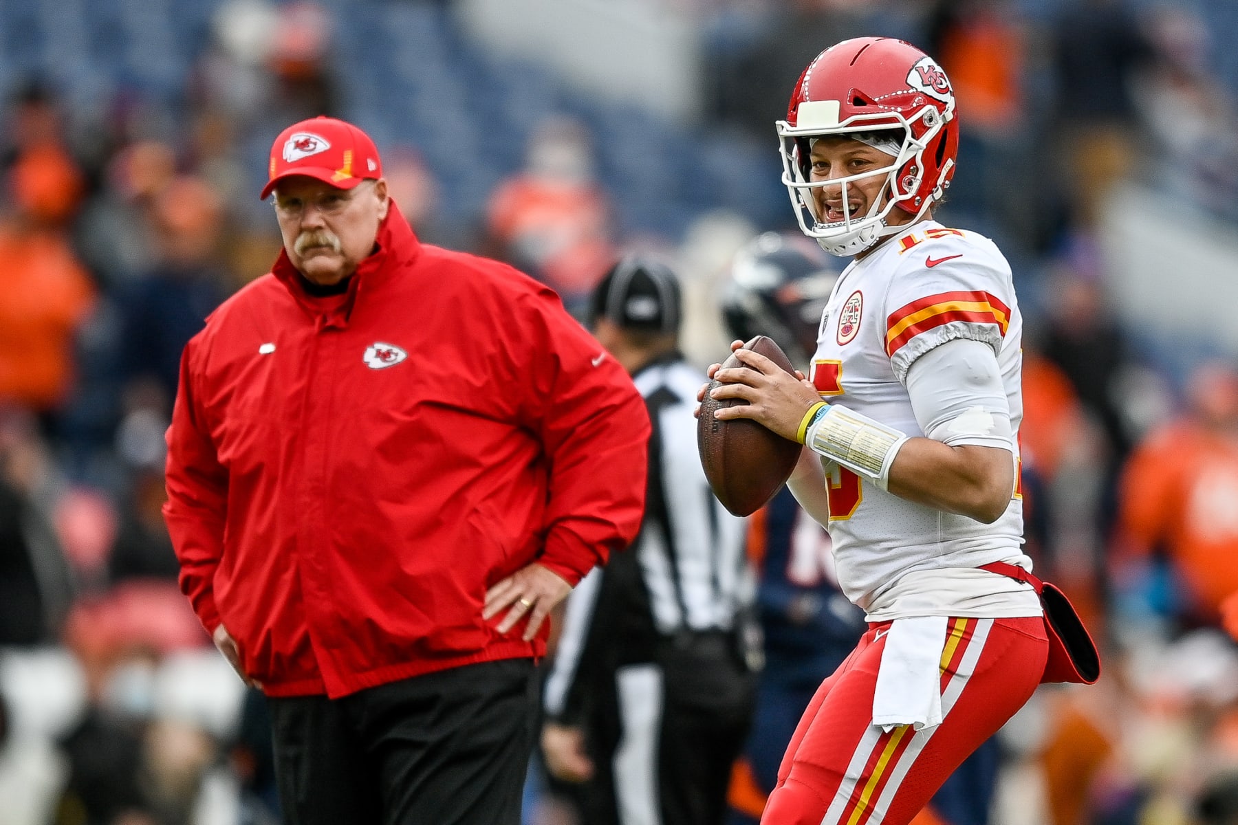 DENVER, COLORADO - JANUARY 08: Patrick Mahomes #15 of the Kansas City Chiefs warms up near head coach Andy Reid prior to facing the Denver Broncos at Empower Field At Mile High on January 08, 2022 in Denver, Colorado. (Photo by Dustin Bradford/Getty Images)