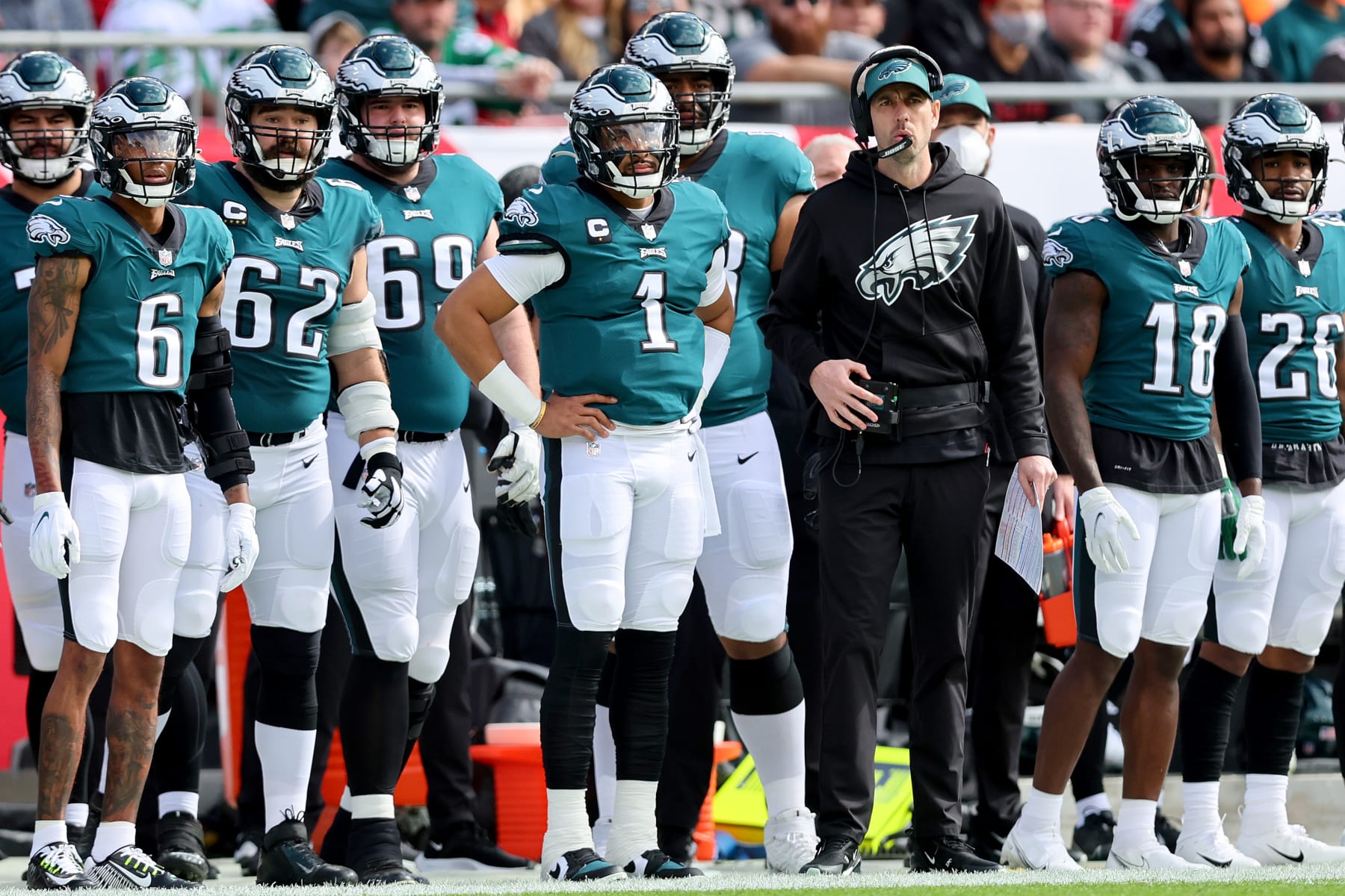 TAMPA, FLORIDA - JANUARY 16: Jalen Hurts #1 of the Philadelphia Eagles looks on with his teammates from the sidelines against the Tampa Bay Buccaneers during the first quarter in the NFC Wild Card Playoff game at Raymond James Stadium on January 16, 2022 in Tampa, Florida. (Photo by Michael Reaves/Getty Images)