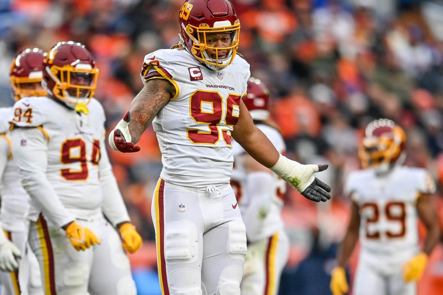 DENVER, CO - OCTOBER 31: Washington Football Team defensive end Chase Young (99) shrugs after a play as he plays defense during a game between the Denver Broncos and the Washington Football Team at Empower Field at Mile High on October 31, 2021 in Denver, Colorado. (Photo by Dustin Bradford/Icon Sportswire via Getty Images)