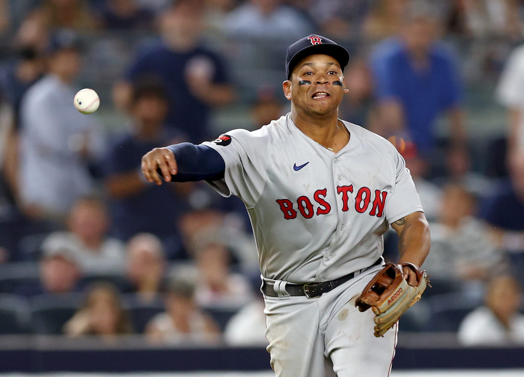 NEW YORK, NEW YORK - JULY 15:  Rafael Devers #11 of the Boston Red Sox sends the ball to first for the out against the New York Yankees at Yankee Stadium on July 15, 2022 in the Bronx borough of New York City. The Boston Red Sox defeated the New York Yankees 5-4 in 11 innings. (Photo by Elsa/Getty Images)