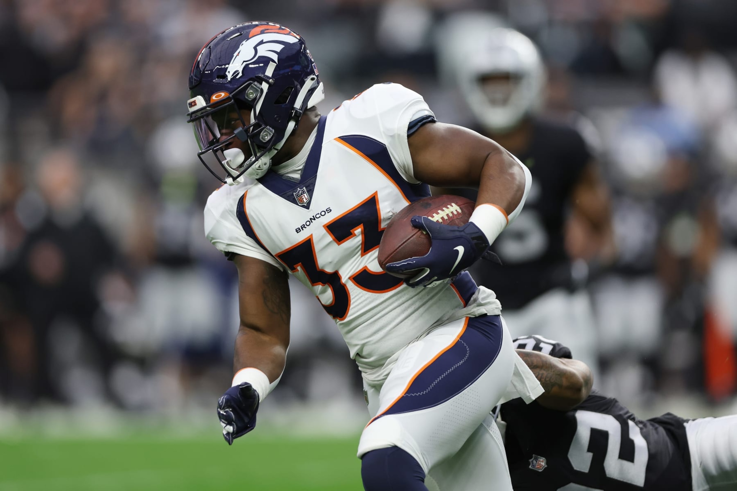 LAS VEGAS, NEVADA - DECEMBER 26: Javonte Williams #33 of the Denver Broncos runs with the ball after the catch against the Las Vegas Raiders in the first quarter at Allegiant Stadium on December 26, 2021 in Las Vegas, Nevada. (Photo by Matthew Stockman/Getty Images)
