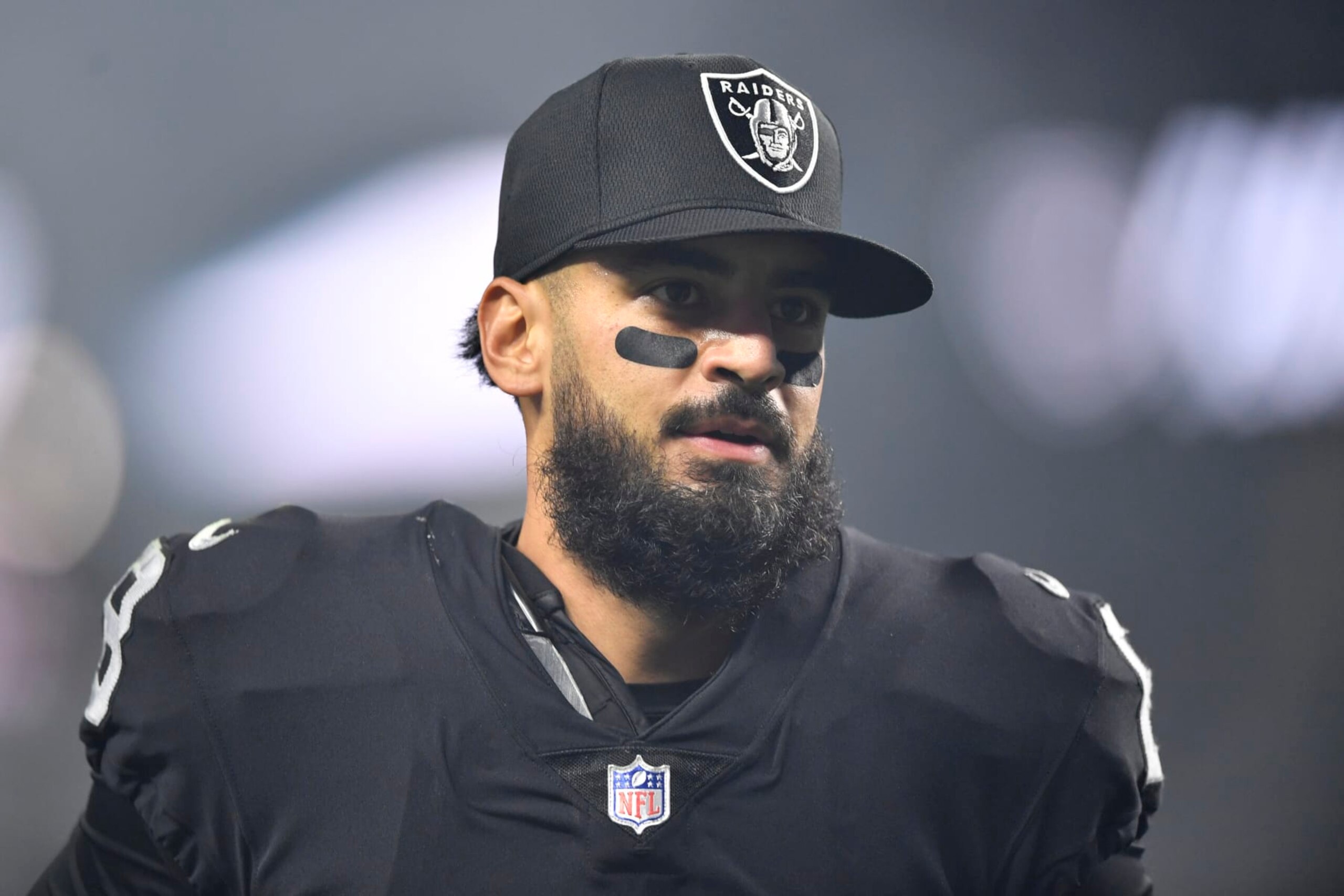 LAS VEGAS, NEVADA - JANUARY 09:  Quarterback Marcus Mariota #8 of the Las Vegas Raiders runs off the field after the team's 35-32 overtime victory over the Los Angeles Chargers at Allegiant Stadium on January 09, 2022 in Las Vegas, Nevada. (Photo by Chris Unger/Getty Images)