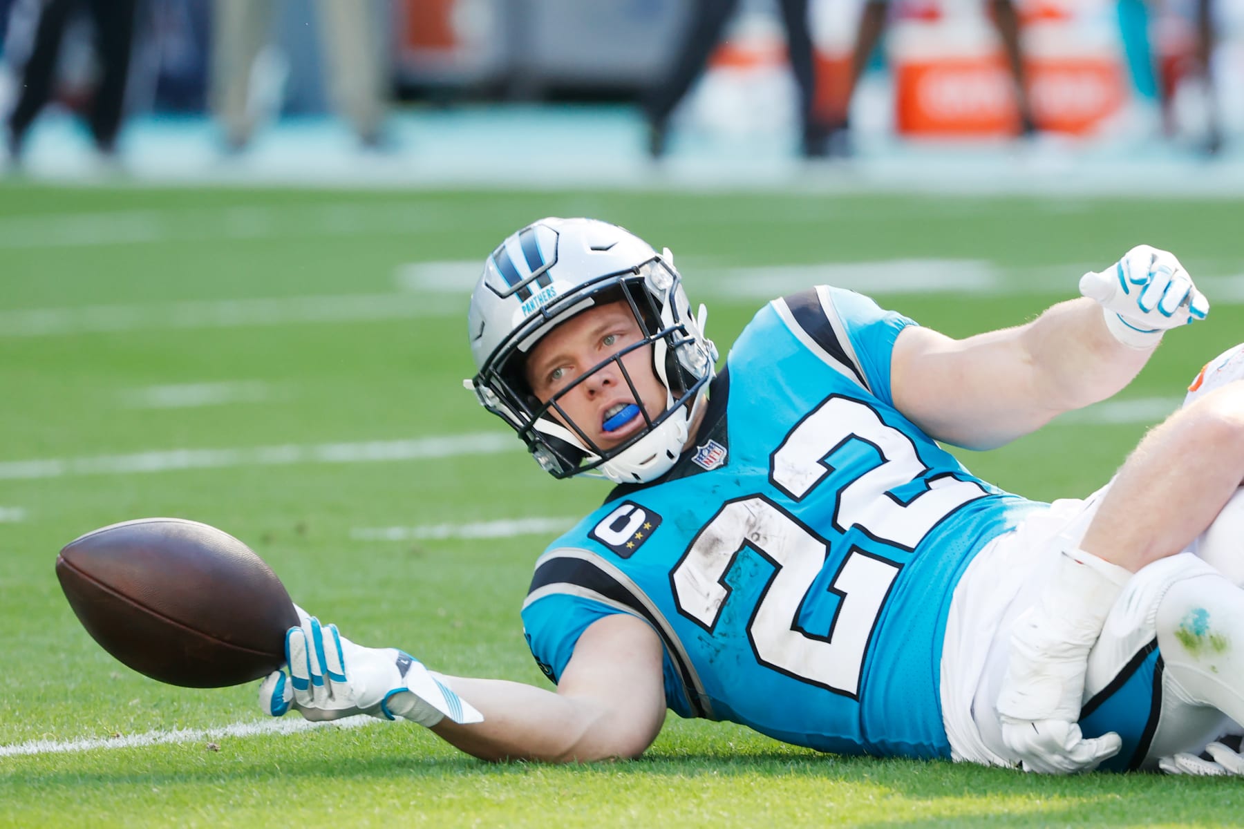 MIAMI GARDENS, FLORIDA - NOVEMBER 28: Christian McCaffrey #22 of the Carolina Panthers during their game against the Miami Dolphins at Hard Rock Stadium on November 28, 2021 in Miami Gardens, Florida. (Photo by Cliff Hawkins/Getty Images)