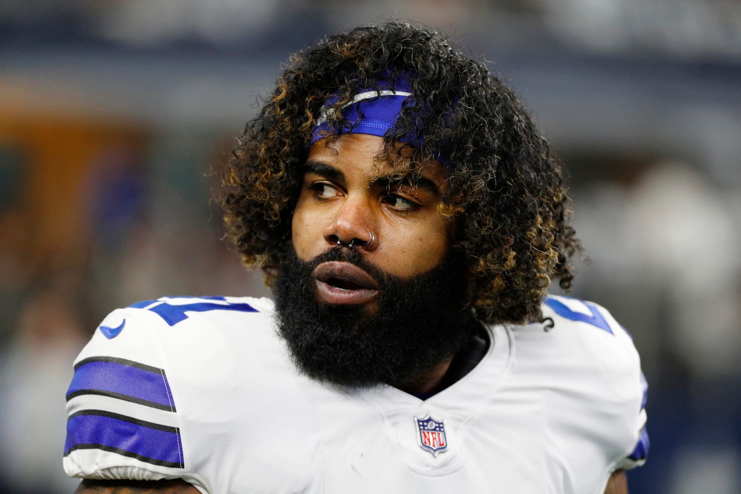 ARLINGTON, TEXAS - JANUARY 16: Ezekiel Elliott #21 of the Dallas Cowboys looks on during pregame warm-ups prior to a game against the San Francisco 49ers in the NFC Wild Card Playoff game at AT&T Stadium on January 16, 2022 in Arlington, Texas. (Photo by Richard Rodriguez/Getty Images)
