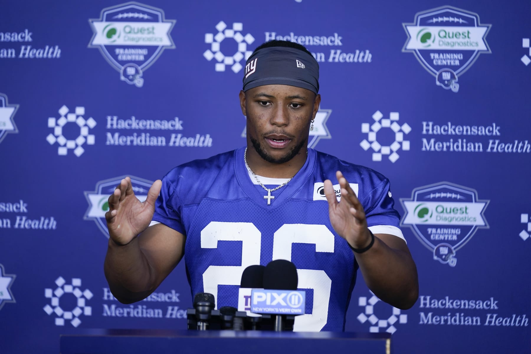 New York Giants' Saquon Barkley speaks to reporters after a practice at the NFL football team's training facility in East Rutherford, N.J., Wednesday, June 8, 2022. (AP Photo/Seth Wenig)