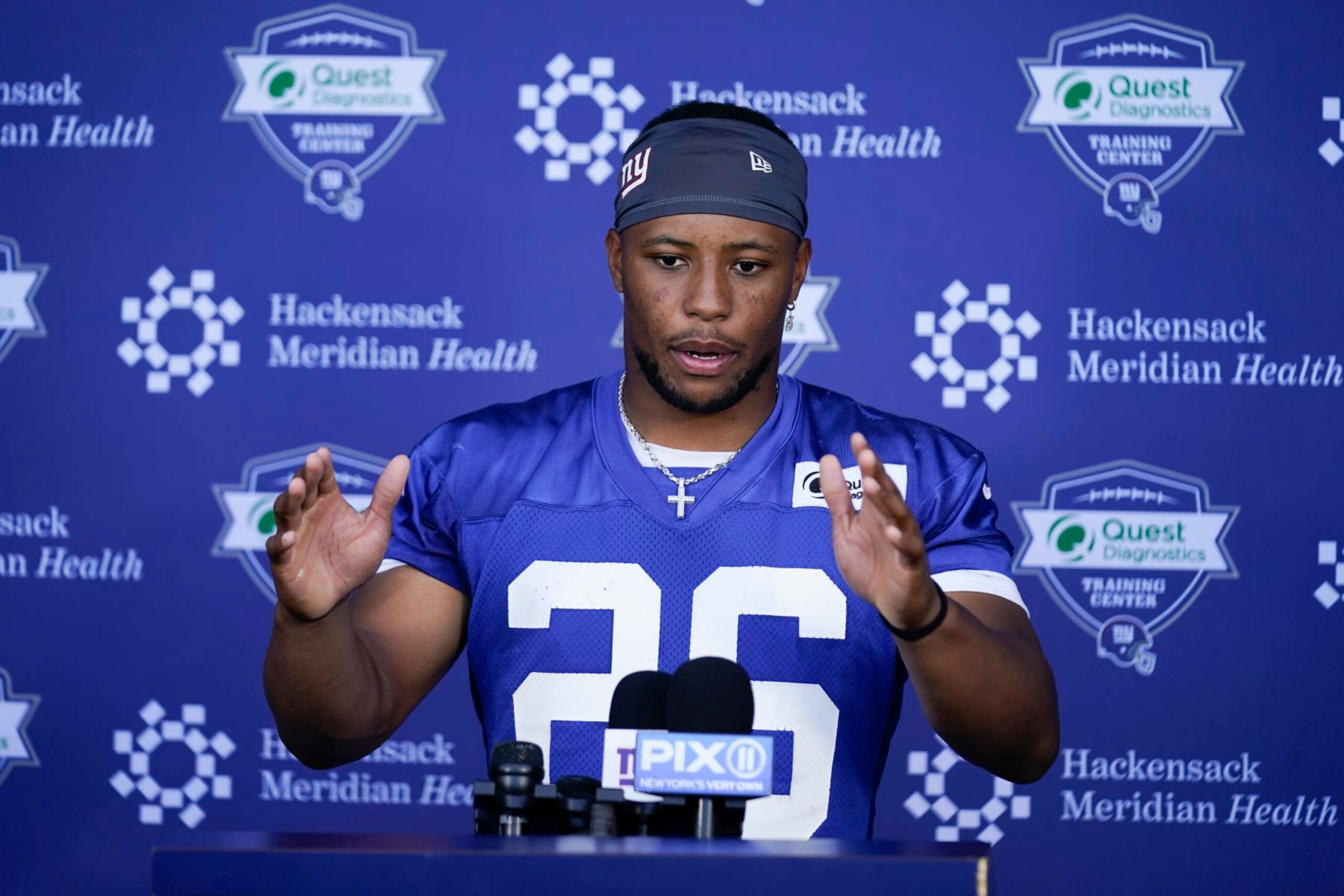 New York Giants' Saquon Barkley speaks to reporters after a practice at the NFL football team's training facility in East Rutherford, N.J., Wednesday, June 8, 2022. (AP Photo/Seth Wenig)