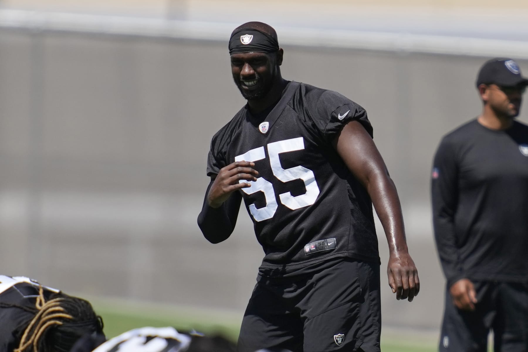 Las Vegas Raiders defensive end Chandler Jones warms up at the NFL football team's practice facility Tuesday, June 7, 2022, in Henderson, Nev. (AP Photo/John Locher)