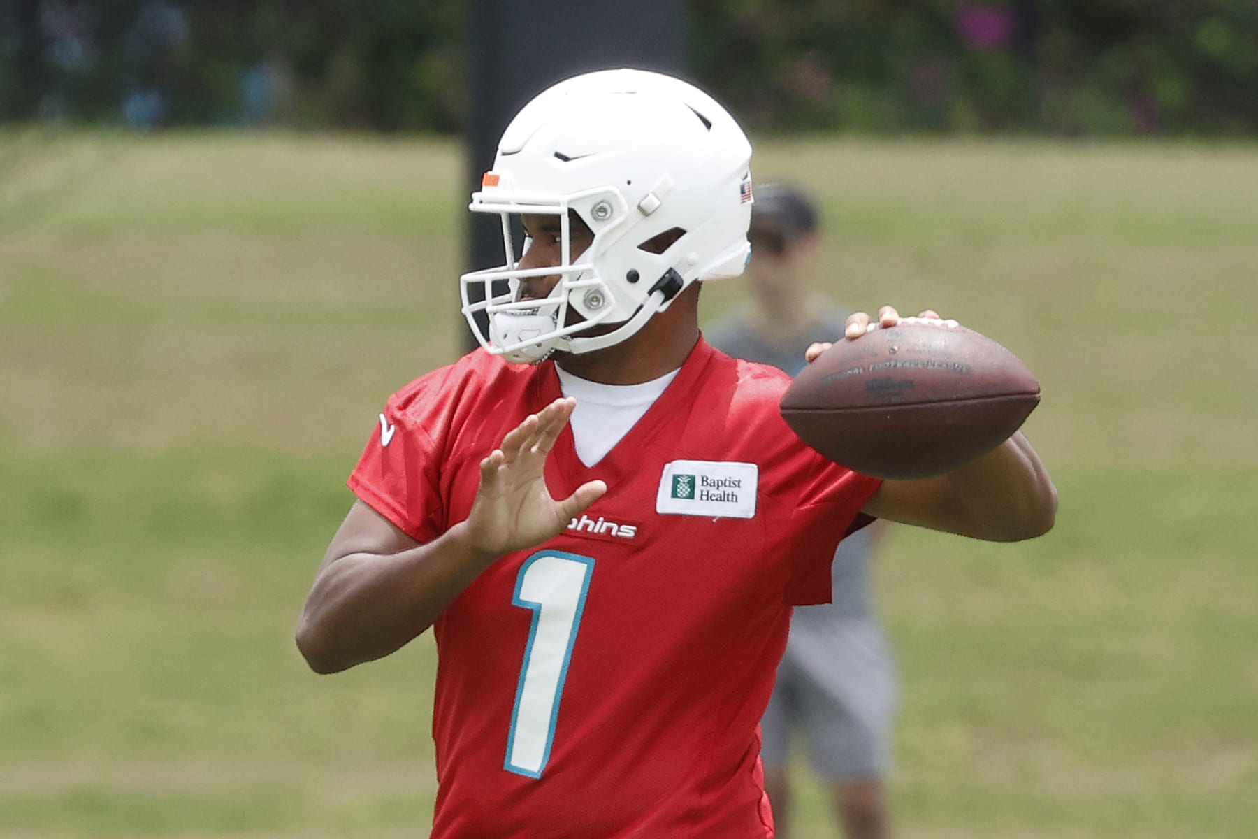 MIAMI GARDENS, FL - JUNE 7: Tua Tagovailoa #1 of the Miami Dolphins throws the ball during the Miami Dolphins Mandatory Minicamp at the Baptist Health Training Complex on June 7, 2022 in Miami Gardens, Florida. (Photo by Joel Auerbach/Getty Images)
