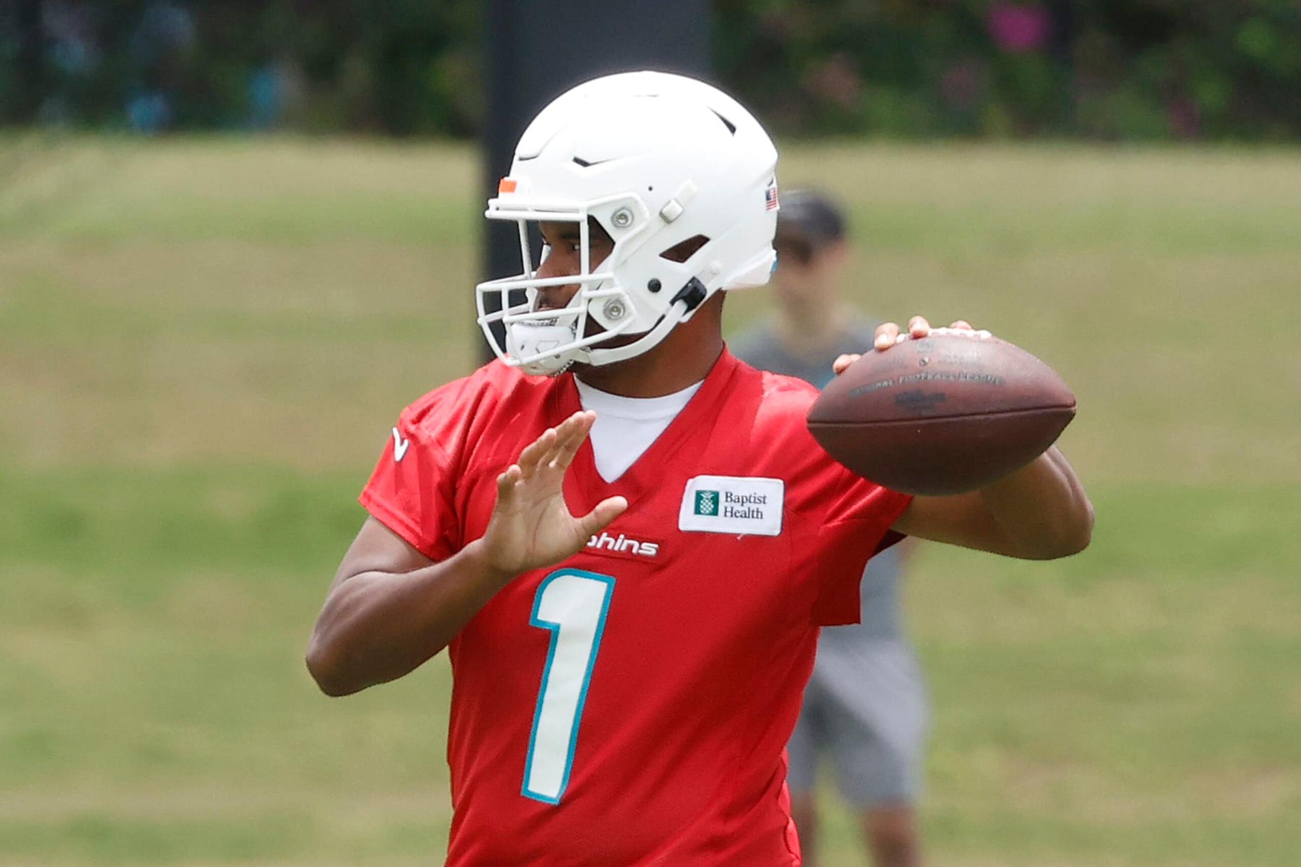 MIAMI GARDENS, FL - JUNE 7: Tua Tagovailoa #1 of the Miami Dolphins throws the ball during the Miami Dolphins Mandatory Minicamp at the Baptist Health Training Complex on June 7, 2022 in Miami Gardens, Florida. (Photo by Joel Auerbach/Getty Images)