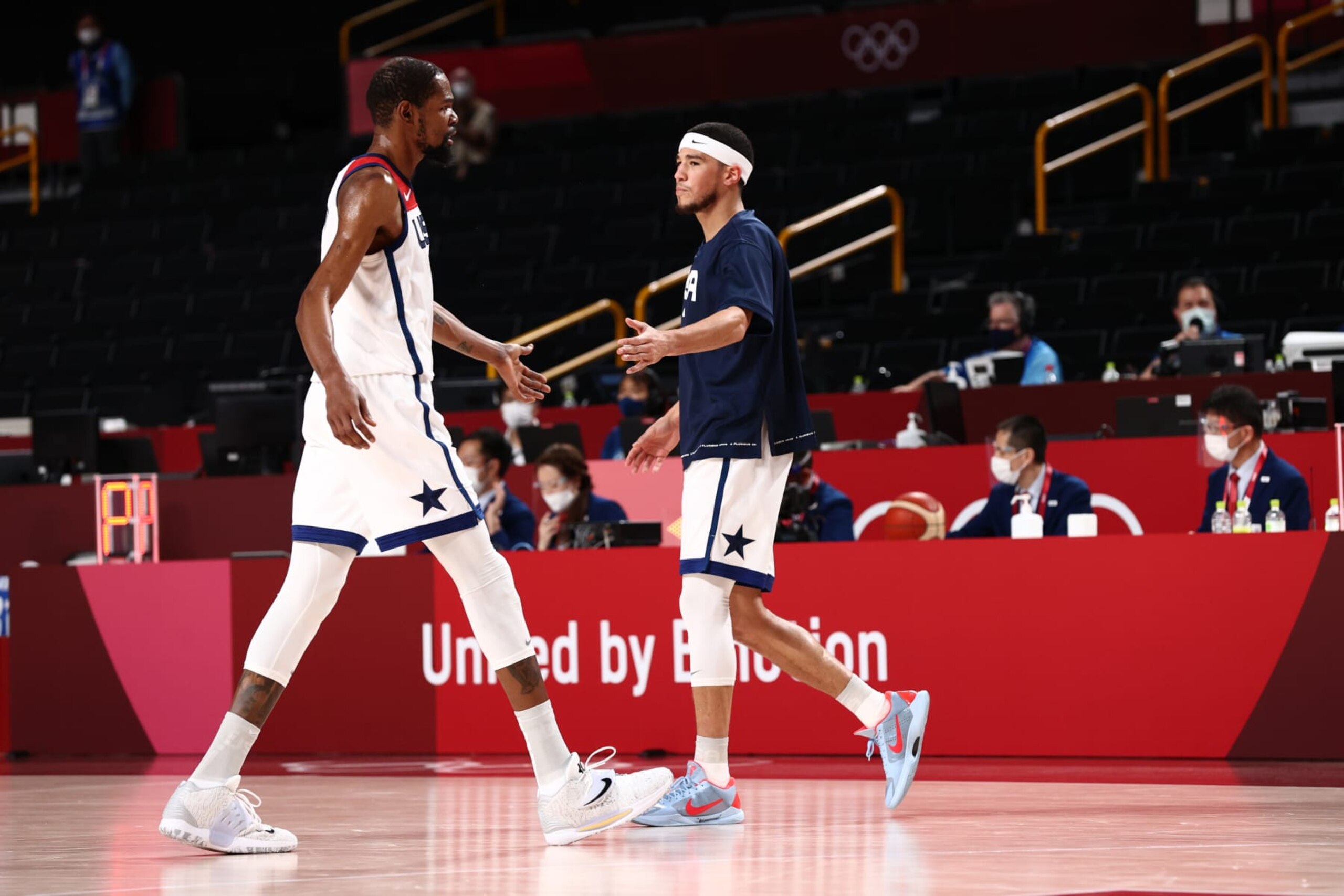 TOKYO, JAPAN - JULY 31: Kevin Durant #7 of the USA Men's National Team high fives Devin Booker #15 of the USA Men's National Team during the 2020 Tokyo Olympics on July 31, 2021 at the Saitama Super Arena in Tokyo, Japan. NOTE TO USER: User expressly acknowledges and agrees that, by downloading and or using this photograph, user is consenting to the terms and conditions of the Getty Images License Agreement. Mandatory Copyright Notice: Copyright 2021 NBAE (Photo by Ned Dishman/NBAE via Getty Images) TOKYO, JAPAN - JULY 31: Kevin Durant #7 of the USA Men's National Team high fives Devin Booker #15 of the USA Men's National Team during the 2020 Tokyo Olympics on July 31, 2021 at the Saitama Super Arena in Tokyo, Japan. NOTE TO USER: User expressly acknowledges and agrees that, by downloading and or using this photograph, user is consenting to the terms and conditions of the Getty Images License Agreement. Mandatory Copyright Notice: Copyright 2021 NBAE (Photo by Ned Dishman/NBAE via Getty Images)
