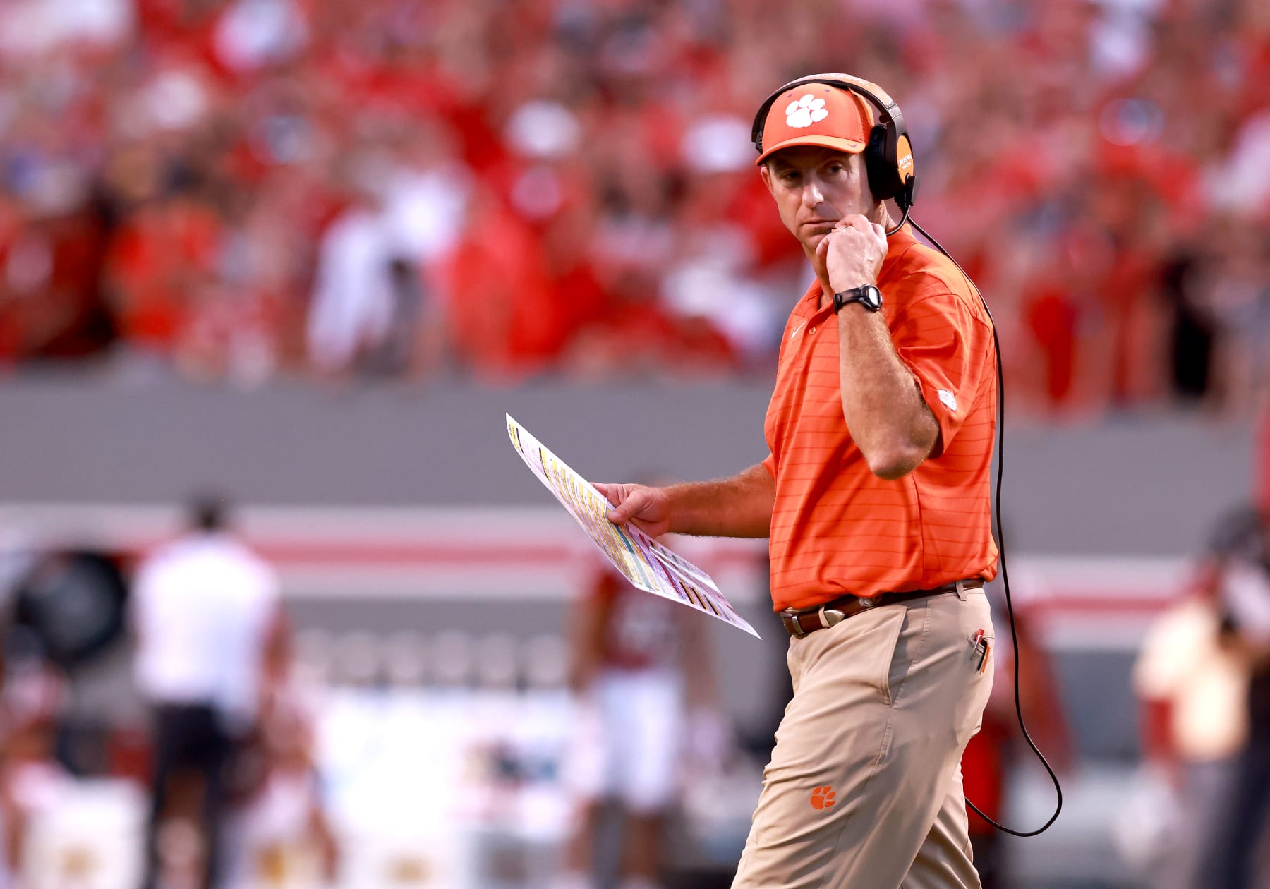 RALEIGH, NORTH CAROLINA - SEPTEMBER 25: Head coach Dabo Swinney of the Clemson Tigers  directs his team against the North Carolina State Wolfpack during their game at Carter-Finley Stadium on September 25, 2021 in Raleigh, North Carolina. North Carolina State won 27-21 in double overtime. (Photo by Grant Halverson/Getty Images)