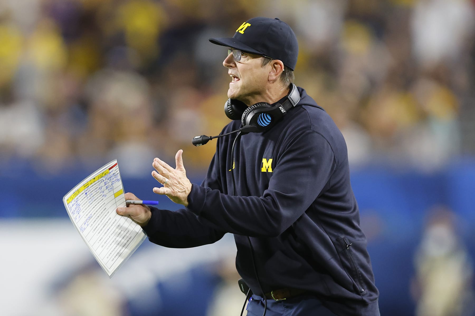 MIAMI GARDENS, FLORIDA - DECEMBER 31: Head coach John Harbaugh of the Michigan Wolverines reacts against the Georgia Bulldogs in the Capital One Orange Bowl for the College Football Playoff semifinal game at Hard Rock Stadium on December 31, 2021 in Miami Gardens, Florida. (Photo by Michael Reaves/Getty Images)