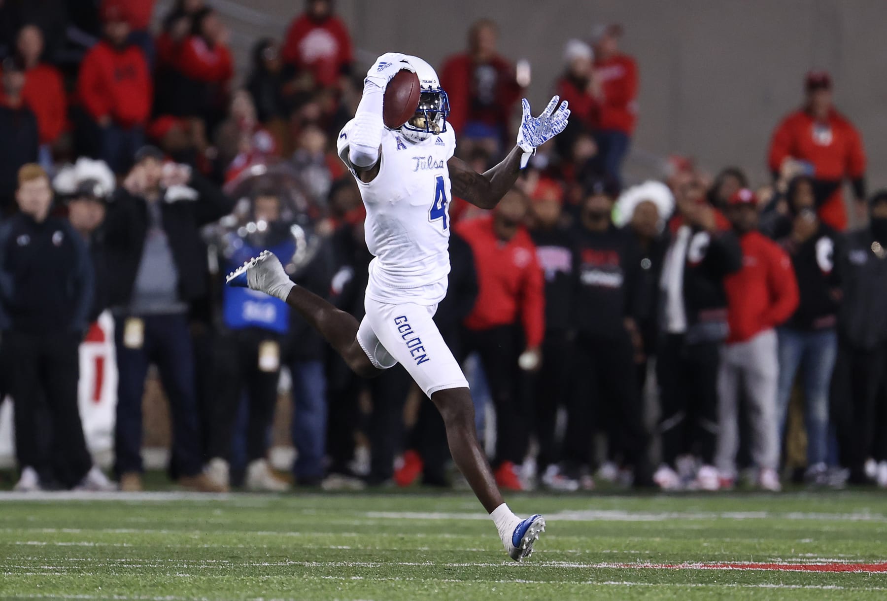CINCINNATI, OHIO - NOVEMBER 06:   Josh Johnson #4 of the Tulsa Golden Hurricane catches a pass with one hand against the Cincinnati Bearcats  at Nippert Stadium on November 06, 2021 in Cincinnati, Ohio. (Photo by Andy Lyons/Getty Images)