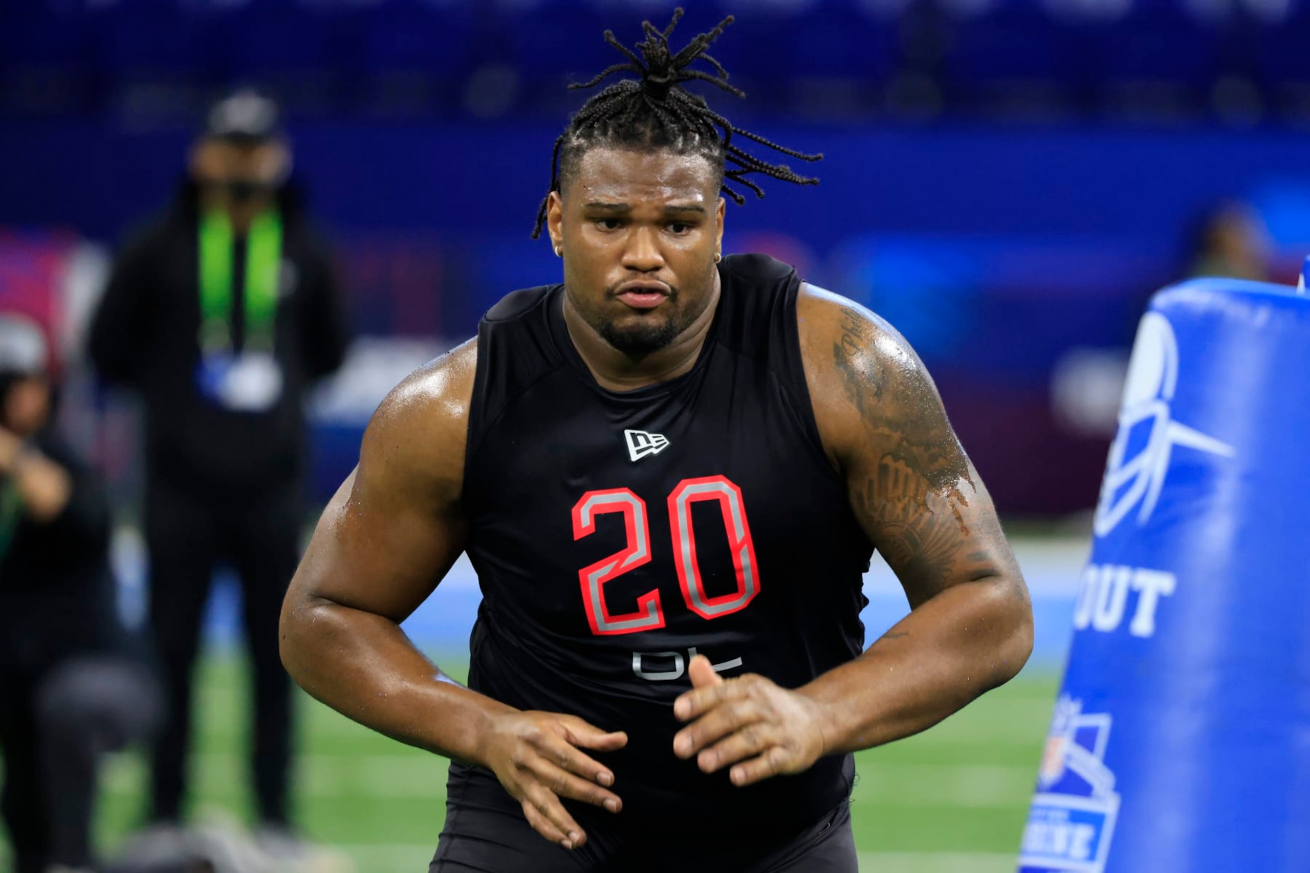 INDIANAPOLIS, INDIANA - MARCH 05: Jayden Peevy #DL20 of the Texas A&M Aggies runs a drill during the NFL Combine during the NFL Combine at Lucas Oil Stadium on March 05, 2022 in Indianapolis, Indiana. (Photo by Justin Casterline/Getty Images)
