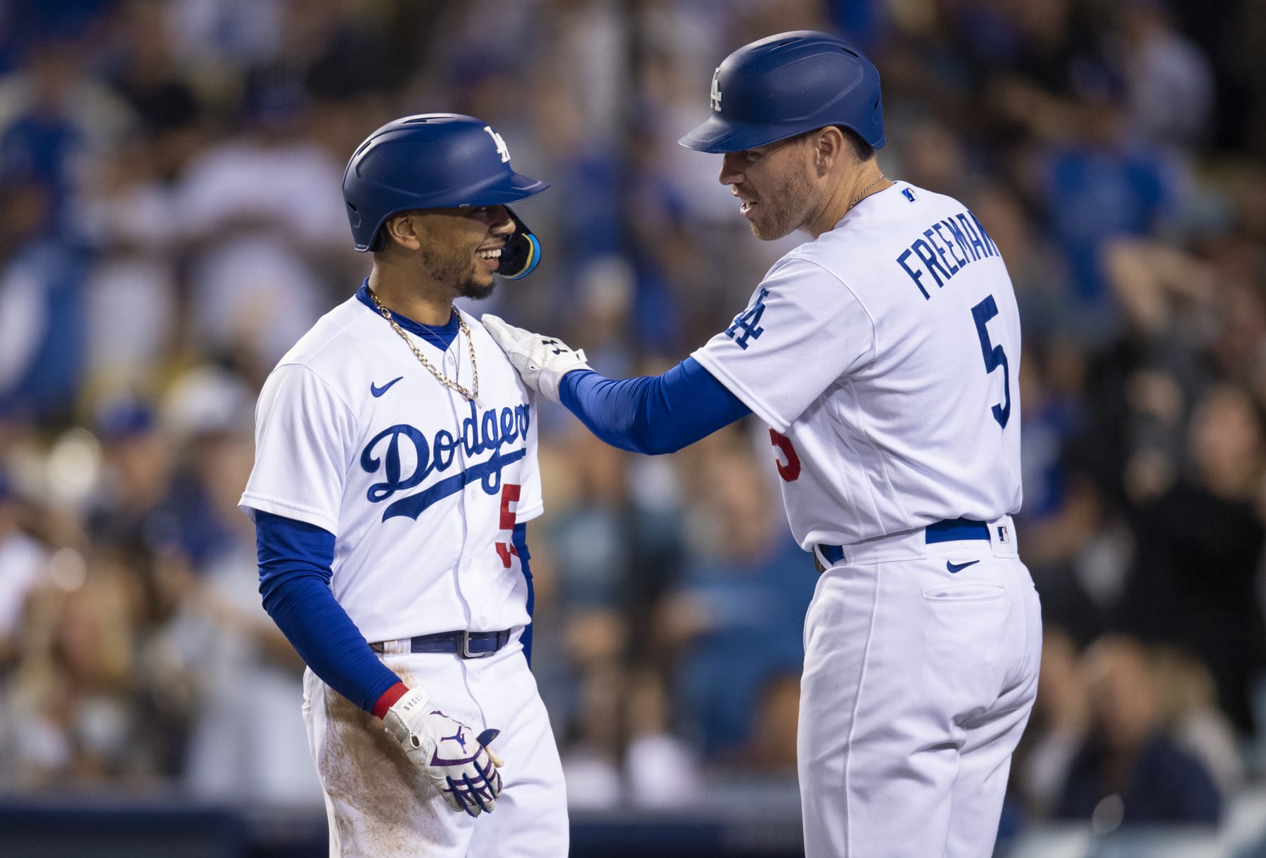 LOS ANGELES, CA - JULY 07: Los Angeles Dodgers Mookie Betts (50) is congratulated by Freddie Freeman (5) after hitting a home run against Chicago Cubs relief pitcher Scott Effross (57) at Dodger Stadium on July 7, 2022 in Los Angeles, CA. (Photo by John McCoy/Icon Sportswire via Getty Images)
